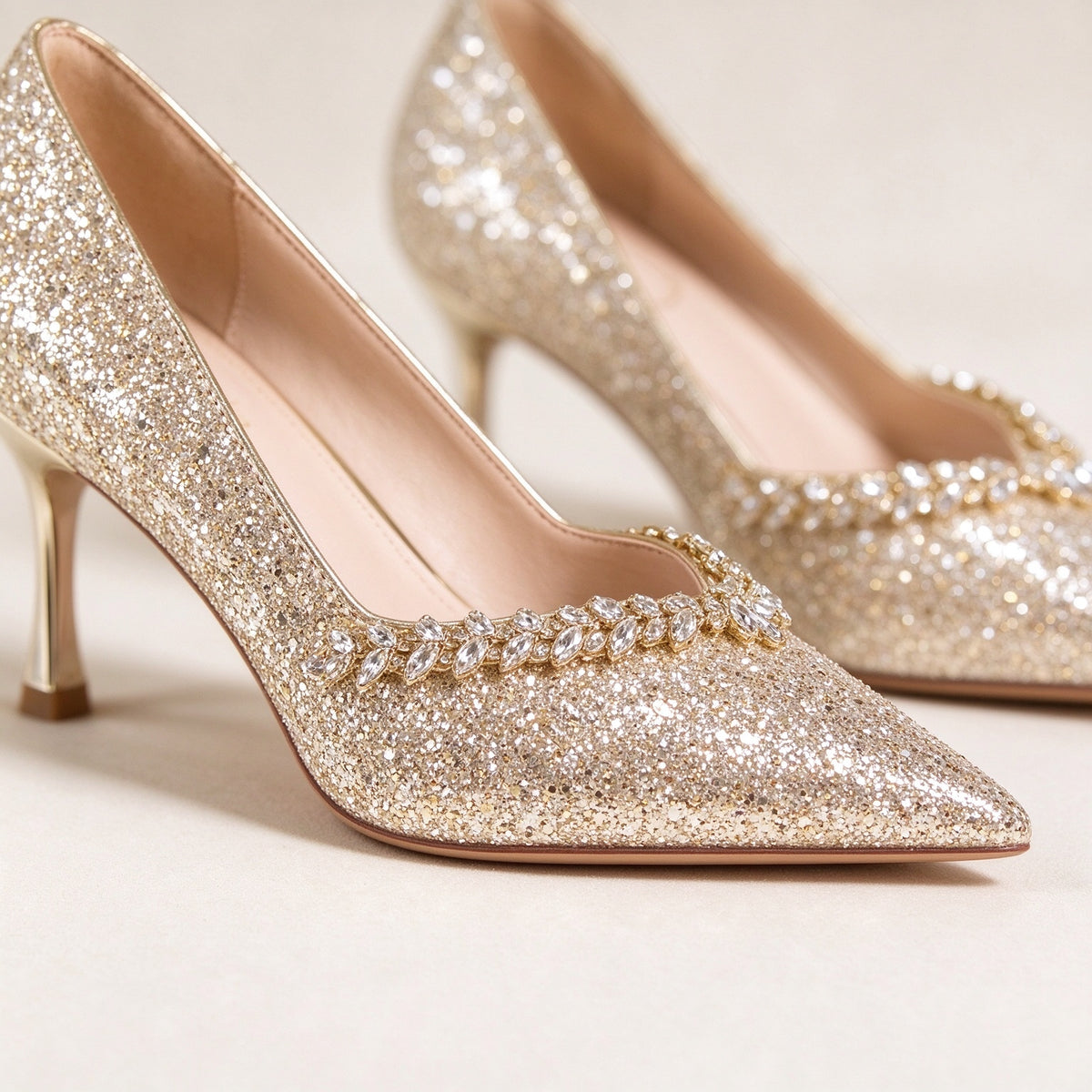 BOLODOO EE0010 close-up of clear leaf-shaped jewel trim and champagne gold glitter finish
