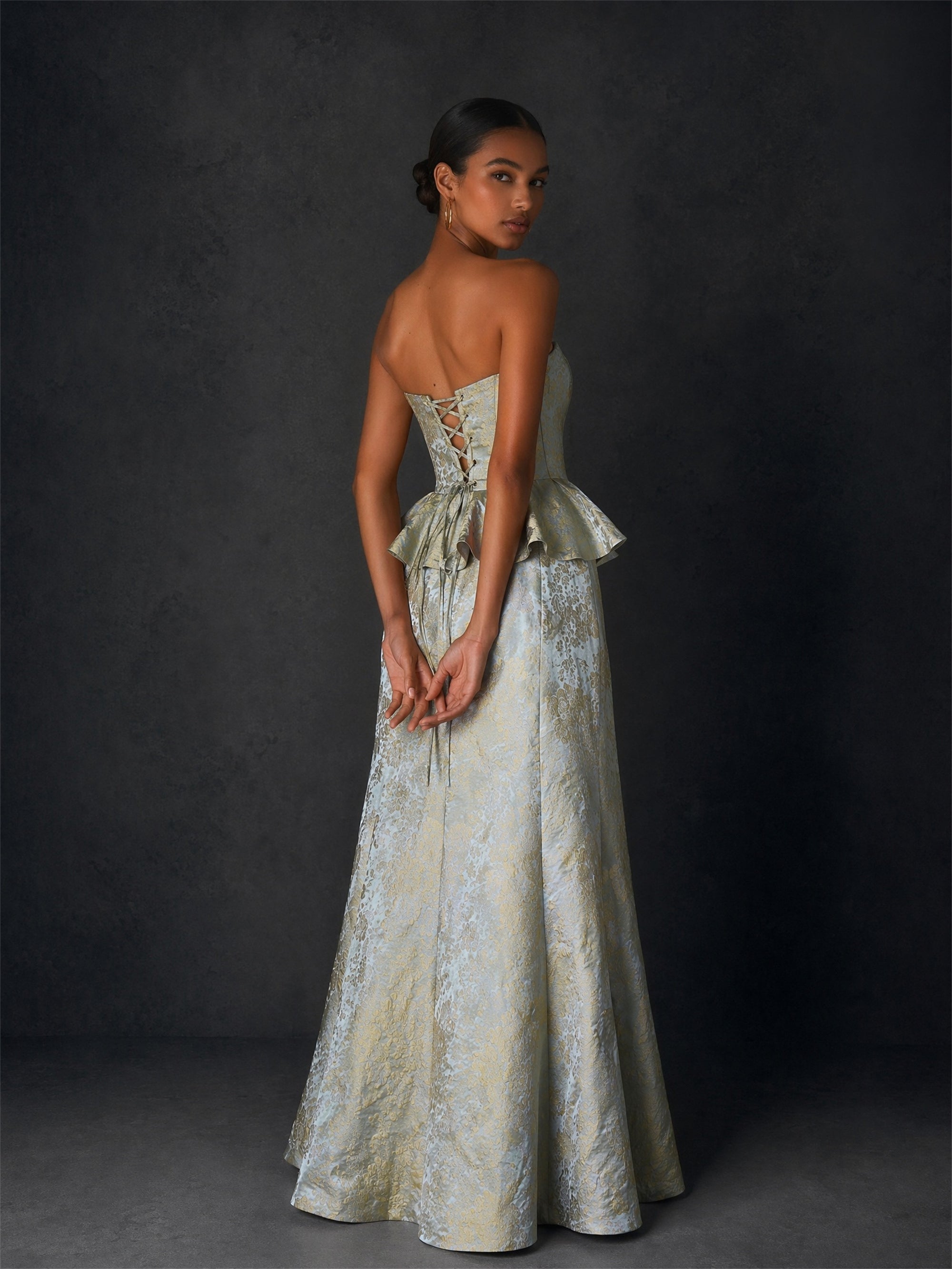 BOLODOO ice blue gold jacquard strapless peplum mermaid gown - front walking view showing movement and floor-sweeping mermaid hem