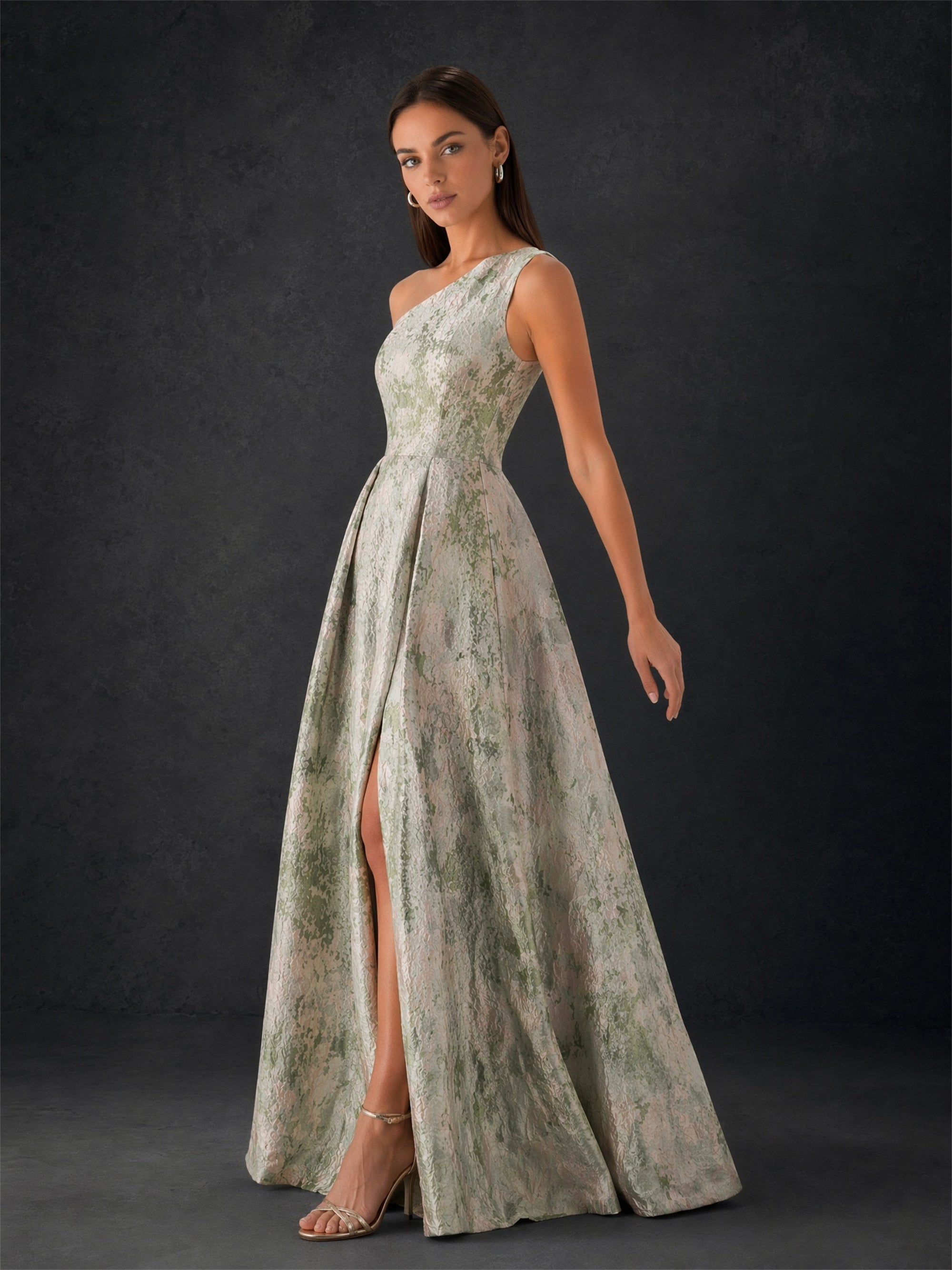 BOLODOO sage green metallic jacquard one-shoulder gown - front view showing side slit and full A-line pleated skirt