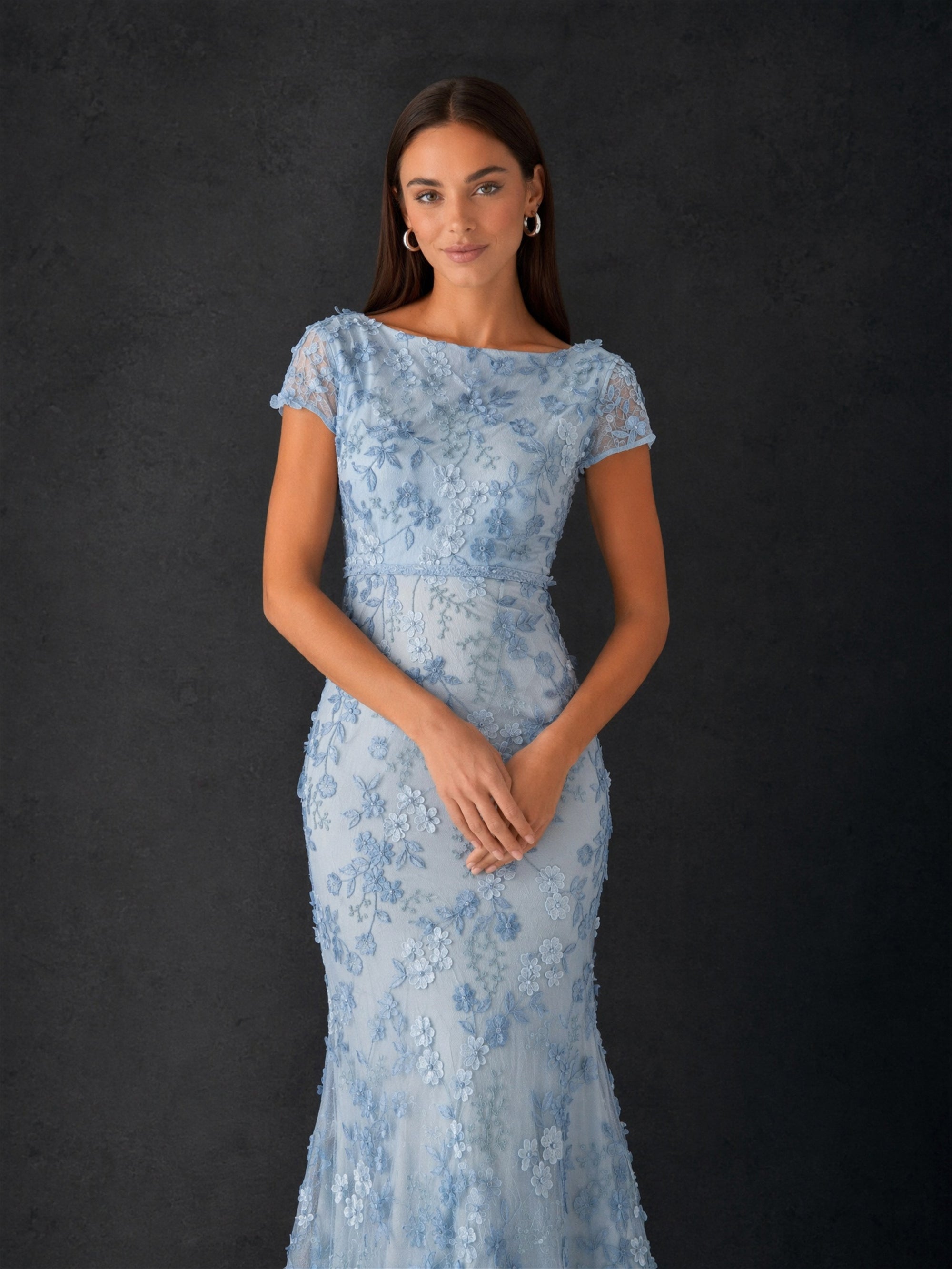 BOLODOO dusty blue 3D floral embroidered lace cap sleeve bateau neck mermaid maxi dress - front three-quarter view hands clasped