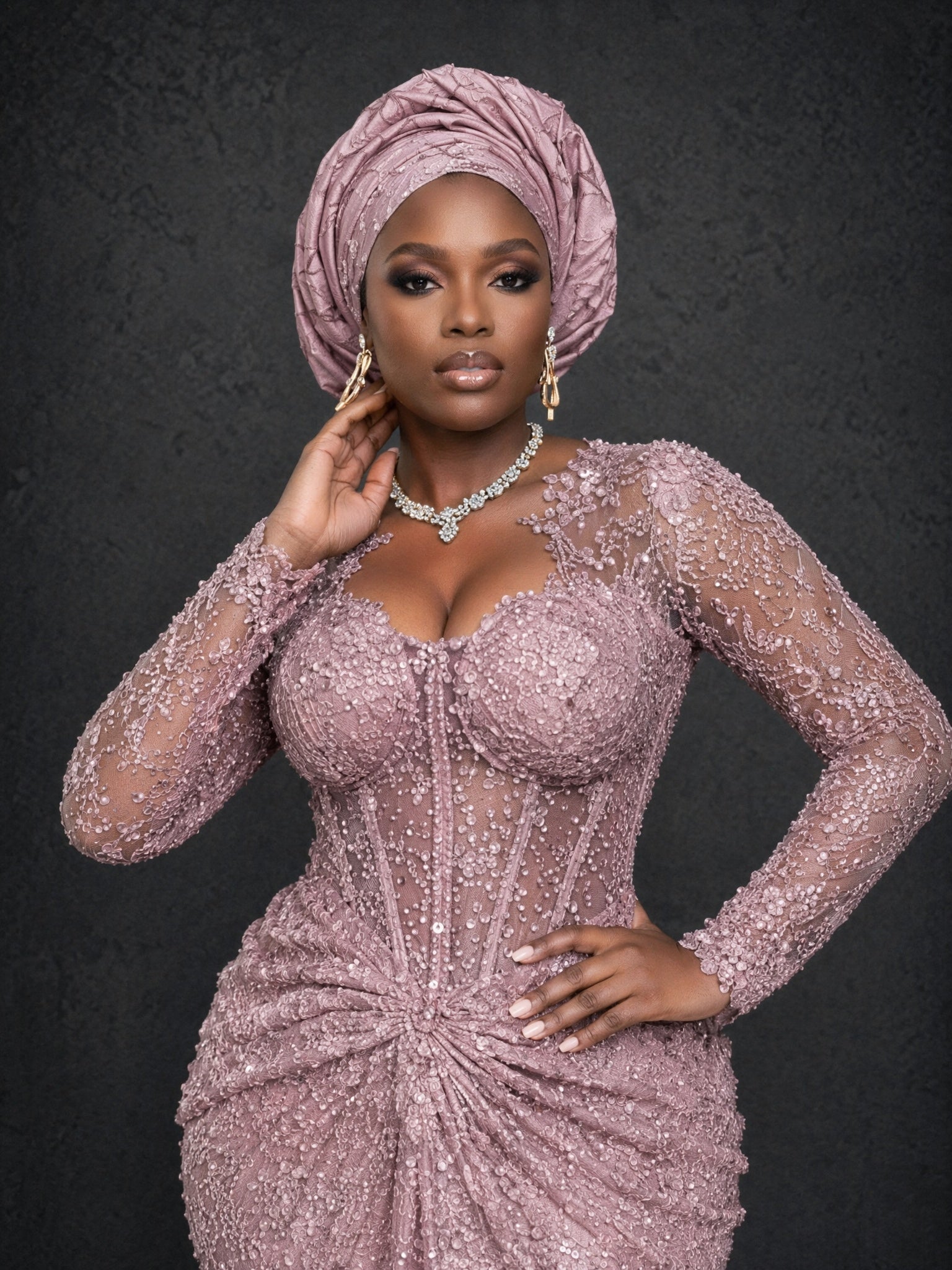 BOLODOO dusty mauve beaded sequin lace long sleeve mermaid gown - front half body close-up showing pearl crystal sweetheart neckline and heavy beading detail