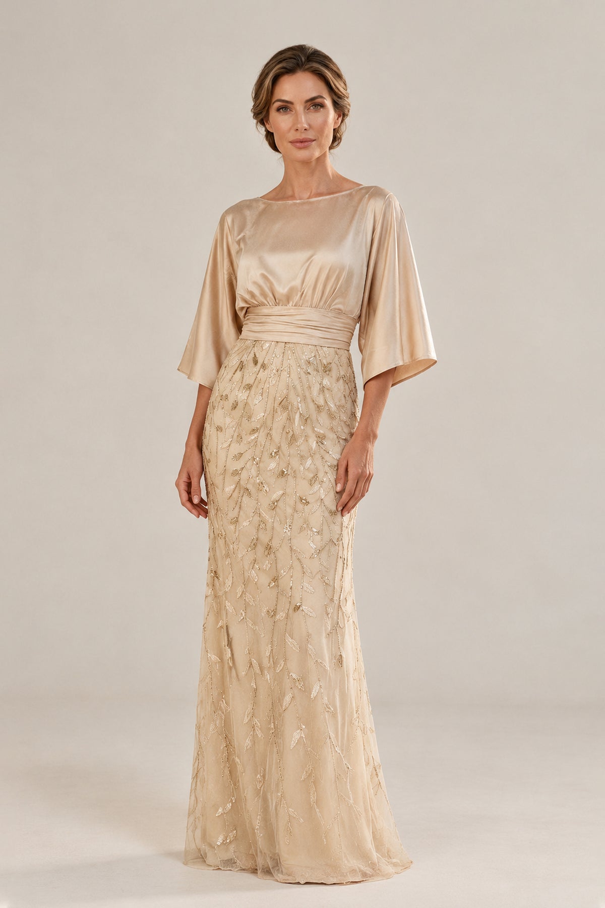 Back view of champagne gold kimono sleeve mermaid gown with covered zipper back