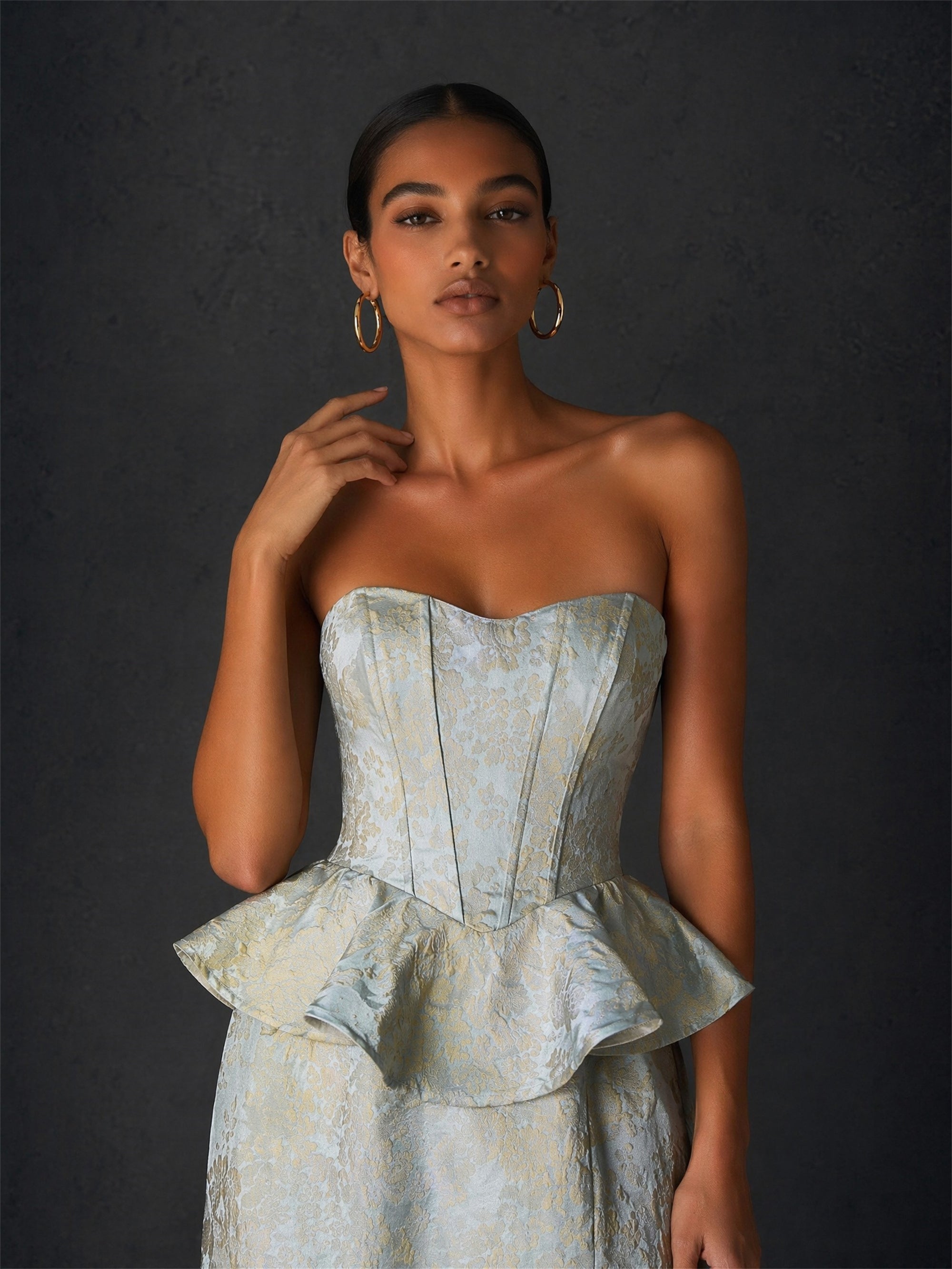 BOLODOO ice blue gold jacquard strapless peplum corset gown - back view showing lace-up corset open back and peplum ruffle detail with ribbon tie closure