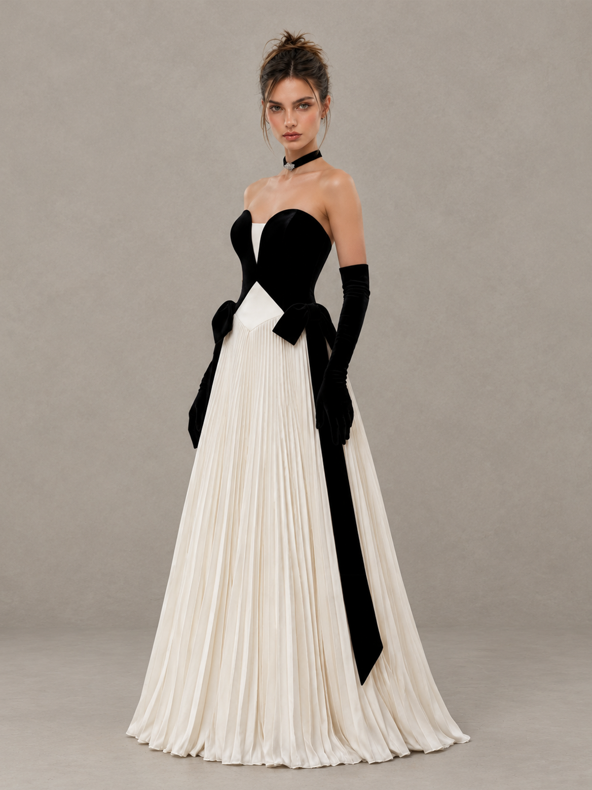 BOLODOO XCD058 strapless pleated formal gown, three-quarter view showing black ribbon waist details