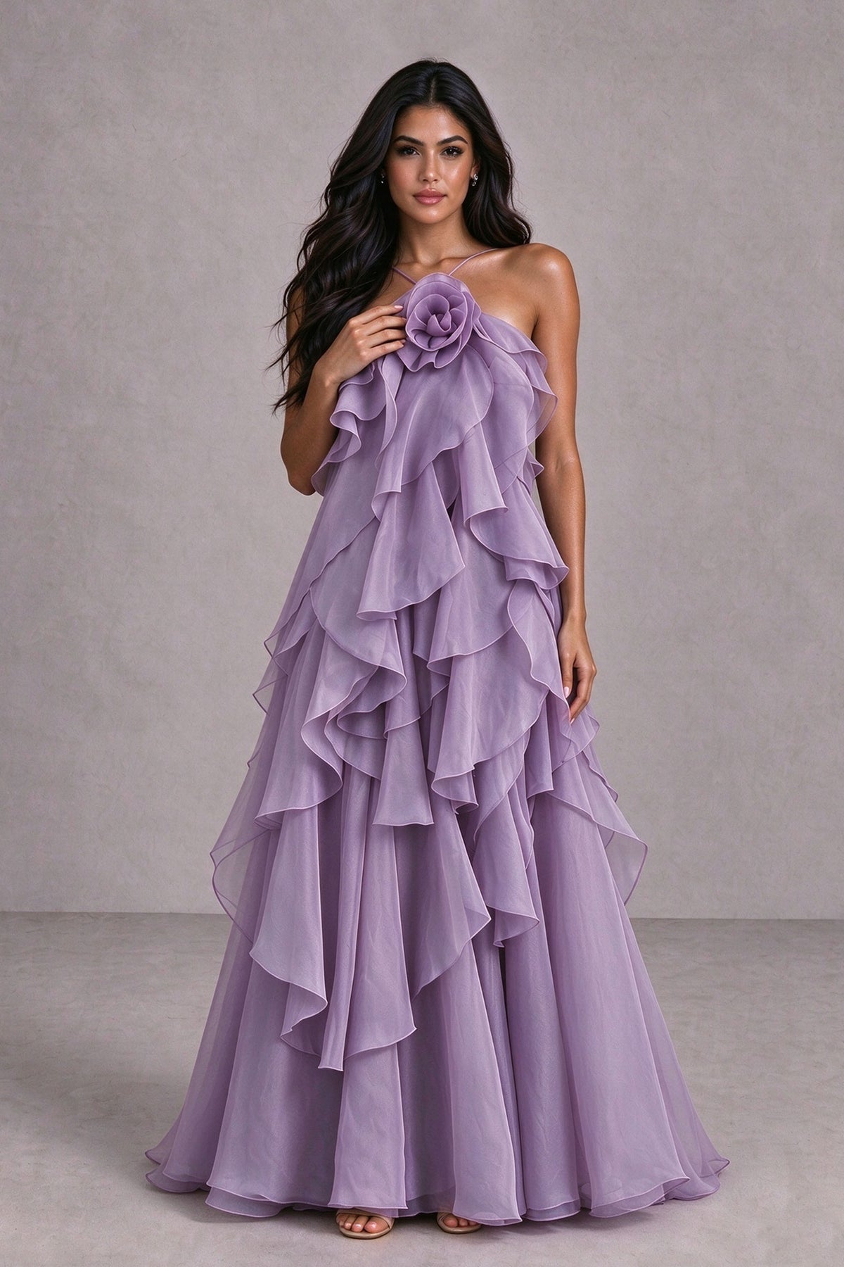 BOLODOO lilac sleeveless ruffle gown with spaghetti straps and dimensional flower detail, styled front view