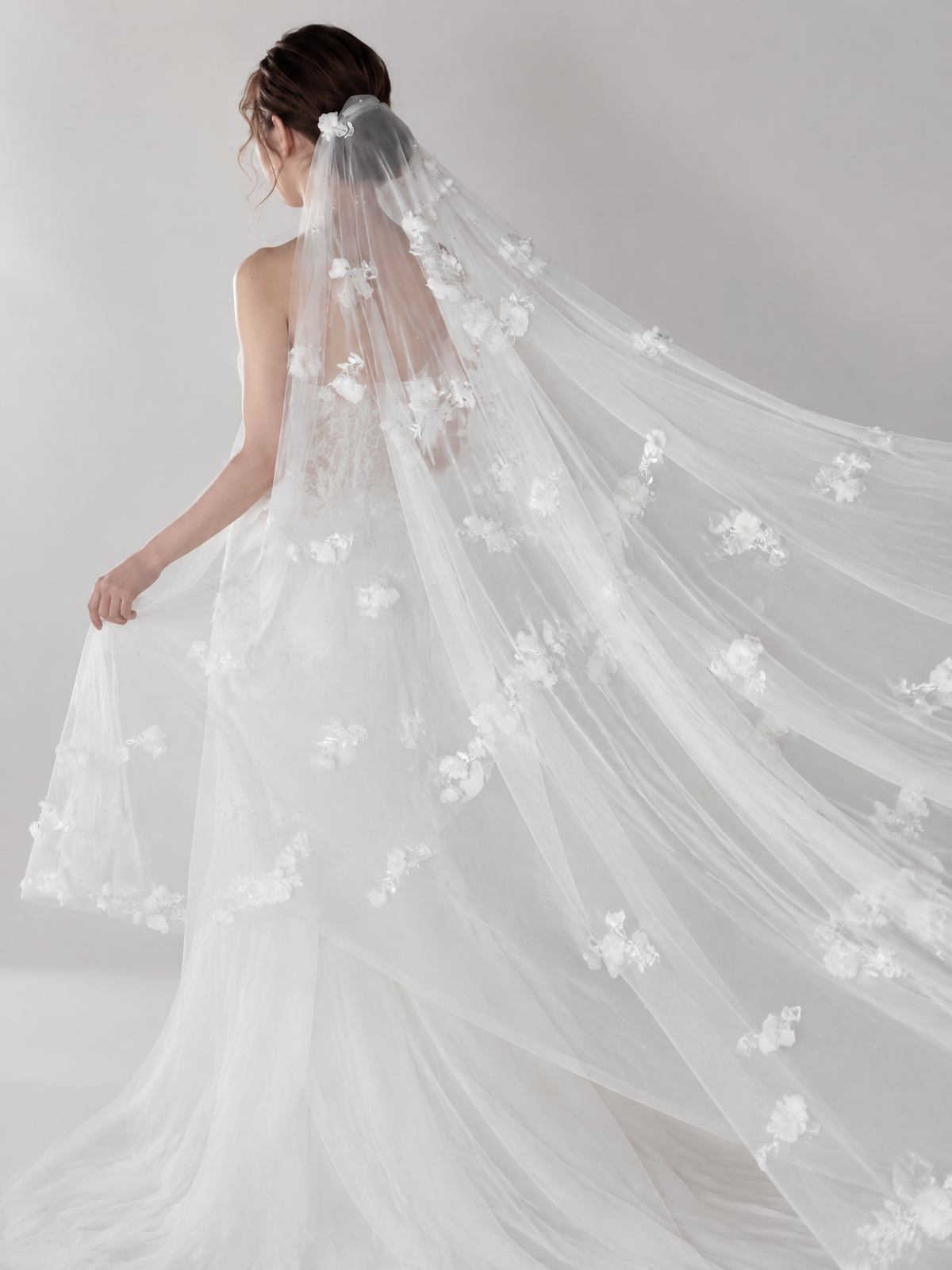 Full back view of BOLODOO floral wedding veil spread to show its sheer drape