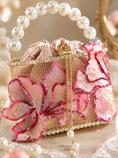 Close-up of BOLODOO EE0001 wedding handbag showing pink floral appliques, sequin edges and sparkling trim
