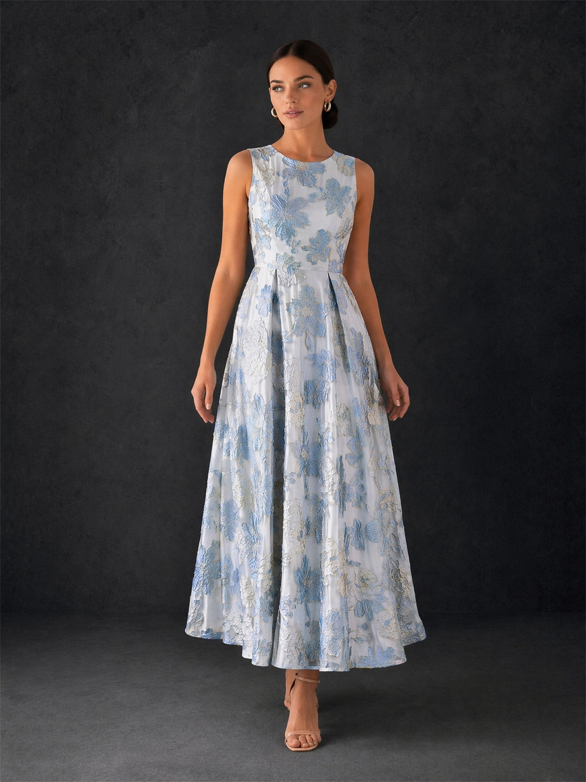 BOLODOO ice blue jacquard midi dress - front view with hand on hip showing structured bodice and full pleated skirt volume