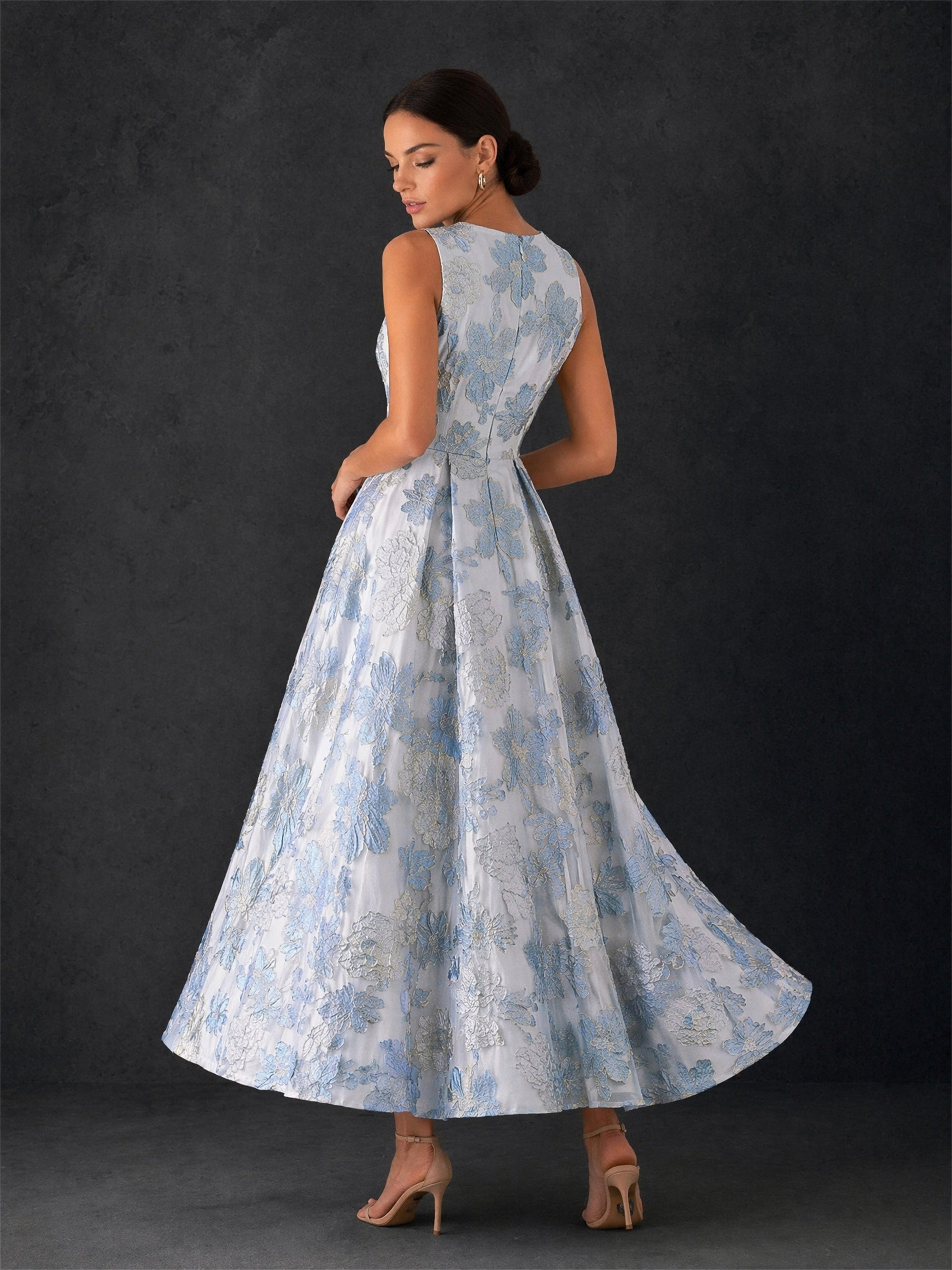BOLODOO ice blue sleeveless jacquard midi dress - back view showing concealed zipper closure and full A-line skirt in motion