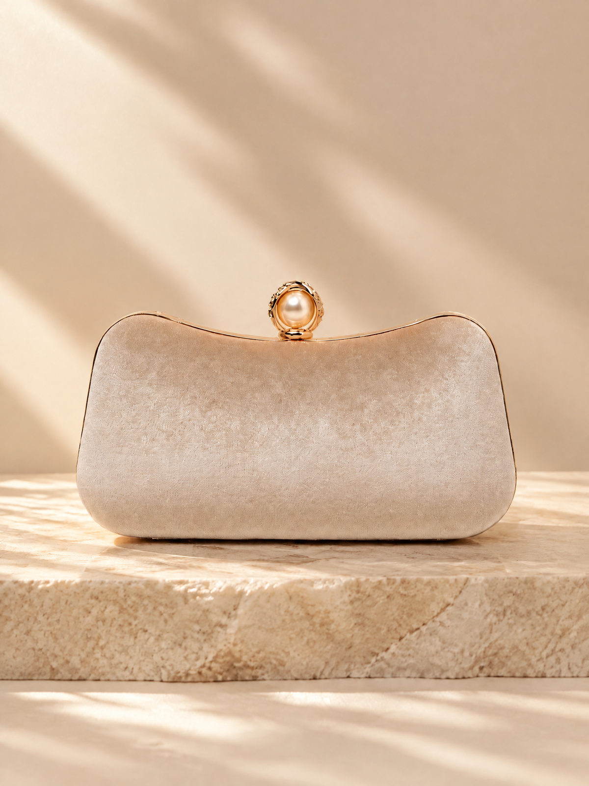 BOLODOO XCD063 ivory evening clutch, front view with pearl-look clasp and curved gold-tone frame