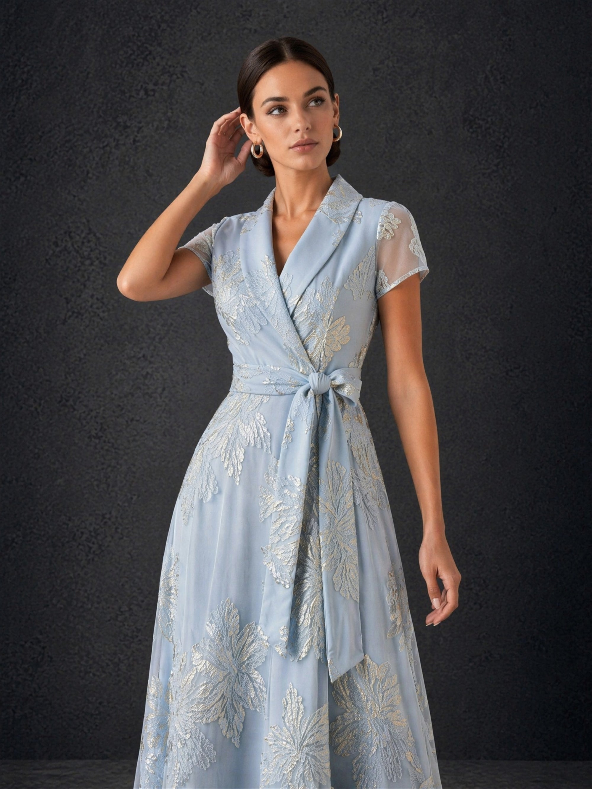 BOLODOO dusty blue metallic jacquard wrap maxi gown - front three-quarter upper body close-up showing shawl collar and metallic jacquard detail