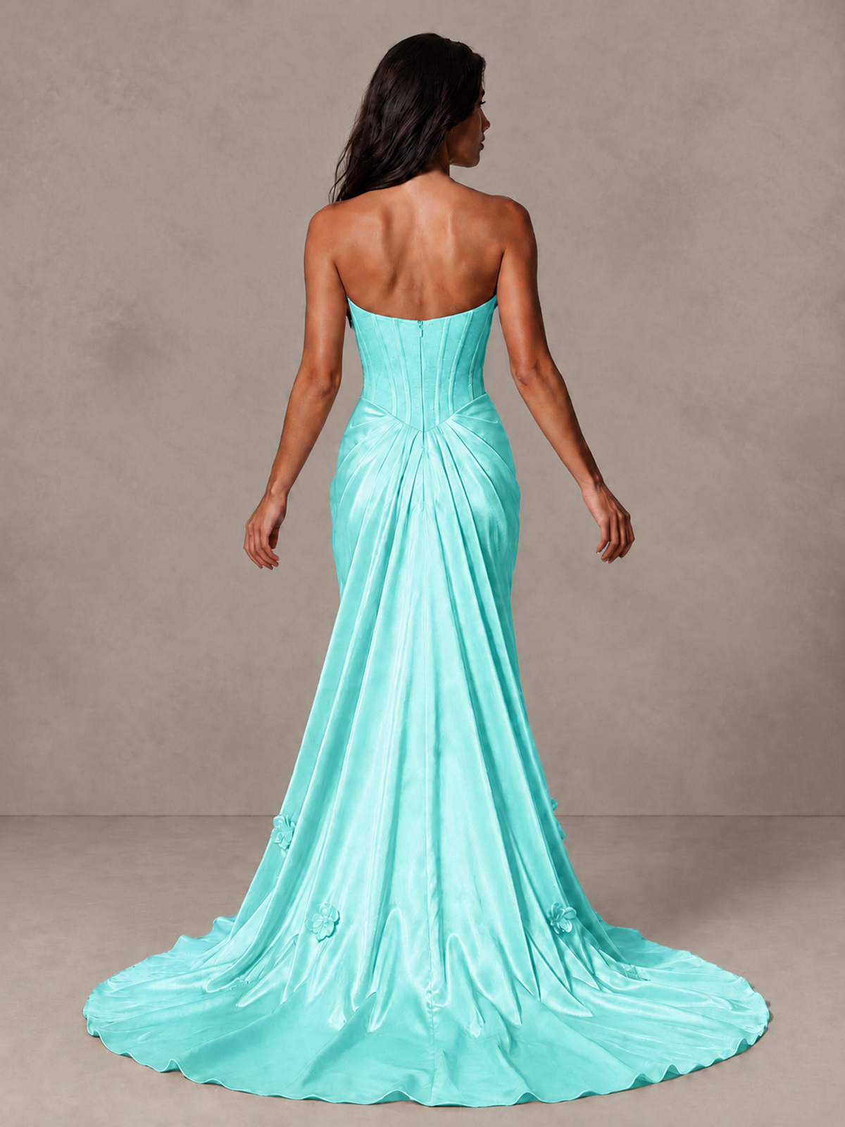 Angled view of BOLODOO aqua strapless corset-style gown with gathered hips and floral skirt