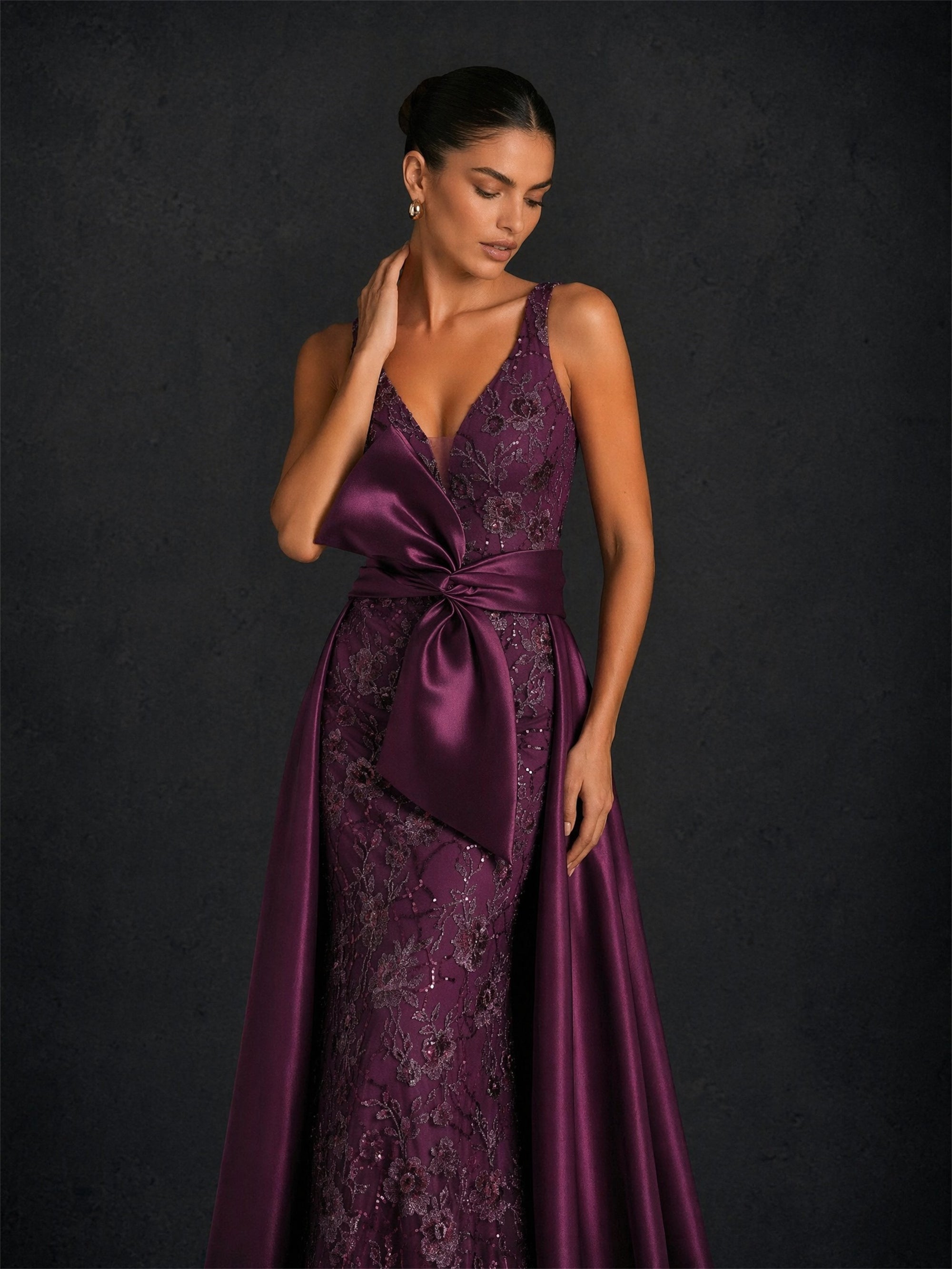BOLODOO BD0374 deep purple sequin lace mermaid gown - front close-up showing deep V-neckline, oversized satin bow and sequin floral lace bodice