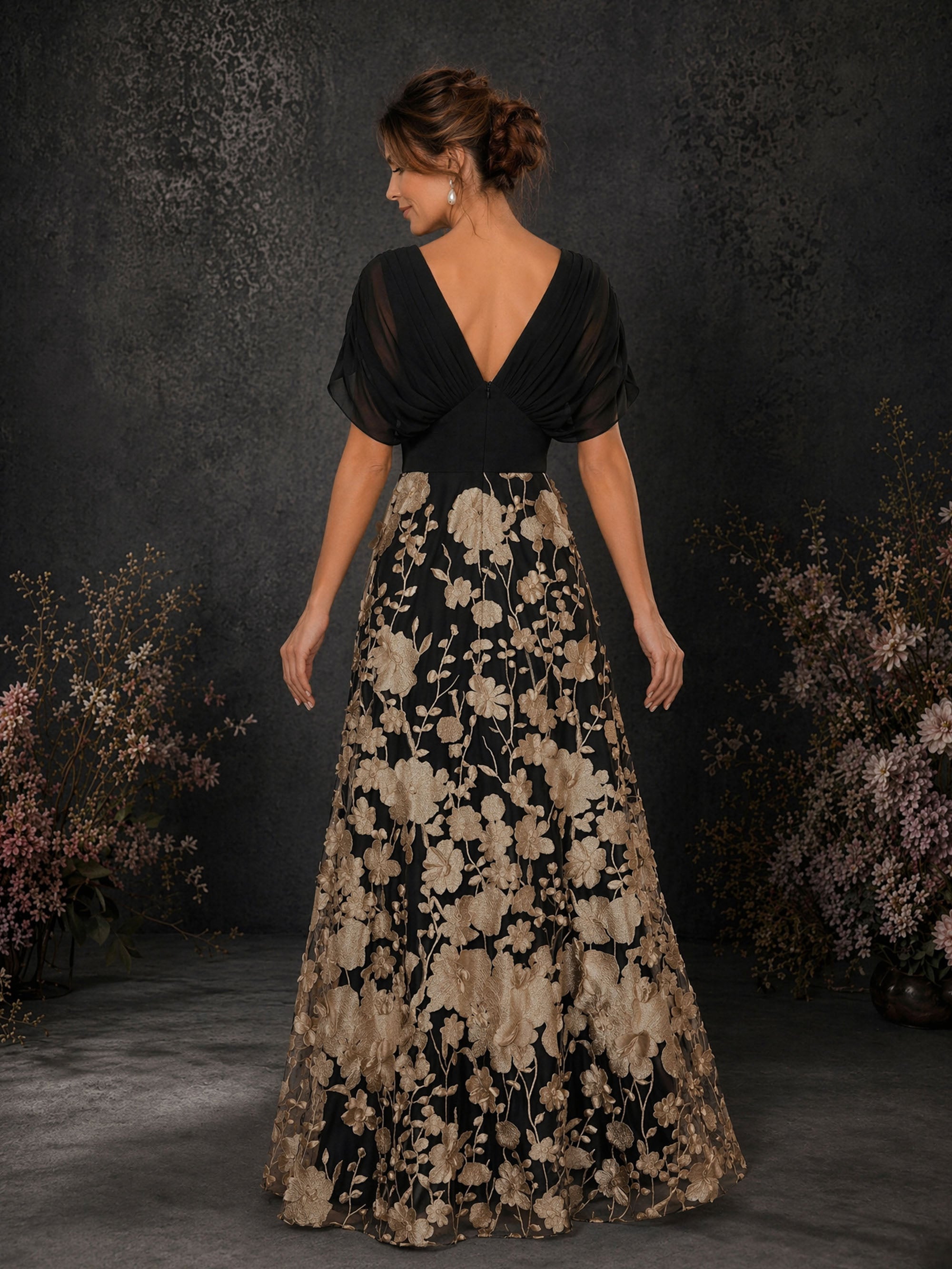 BOLODOO BD0414 black and champagne gold chiffon V-neck flutter sleeve floral embroidered A-line floor-length gown – front view showing deep V-neckline and 3D floral embroidered skirt