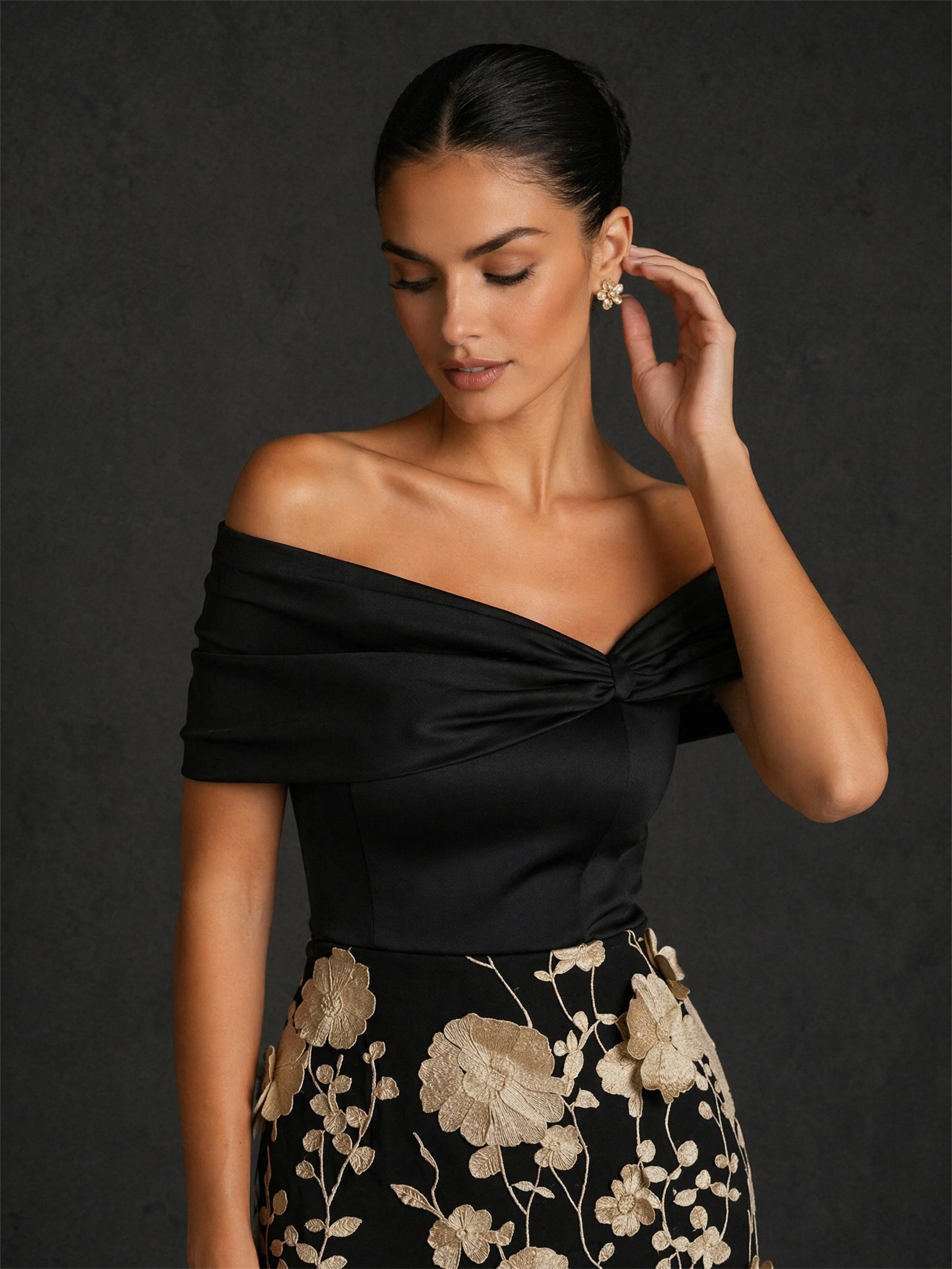 BOLODOO BD0422 black and champagne gold off-shoulder twisted V-neck cap sleeve 3D floral appliqué tea length dress – close-up of twisted off-shoulder neckline and champagne gold 3D floral appliqué skirt detail