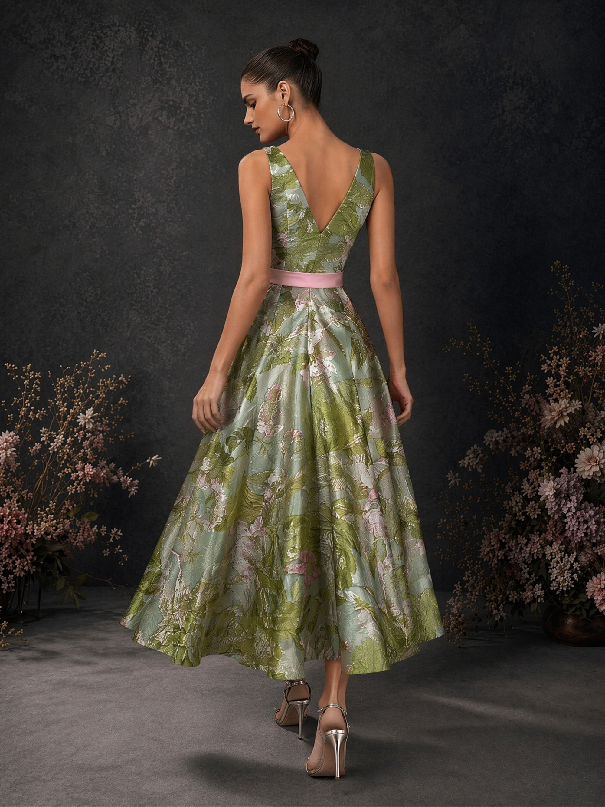 BOLODOO olive green floral jacquard sleeveless A-line tea length dress with deep V open back and pink satin bow belt – back full length view