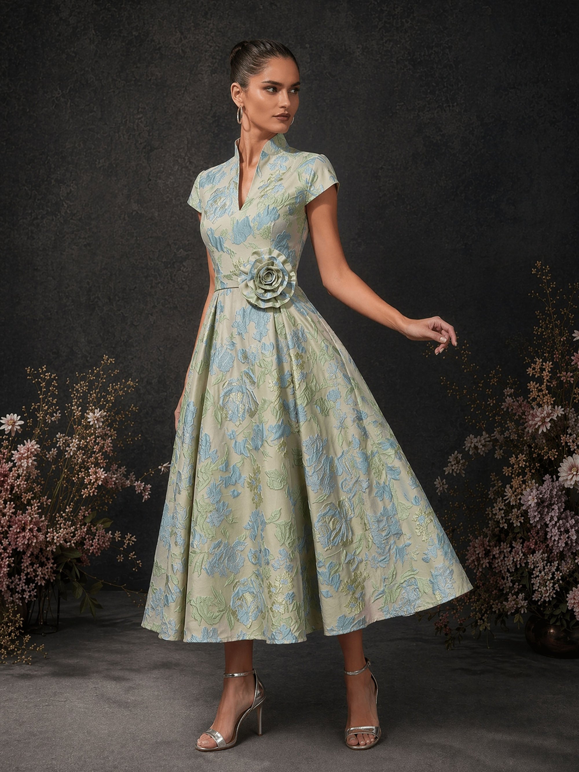 BOLODOO champagne ice blue floral brocade mandarin collar cap sleeve A-line midi dress with 3D rose waist corsage – front three-quarter dynamic view