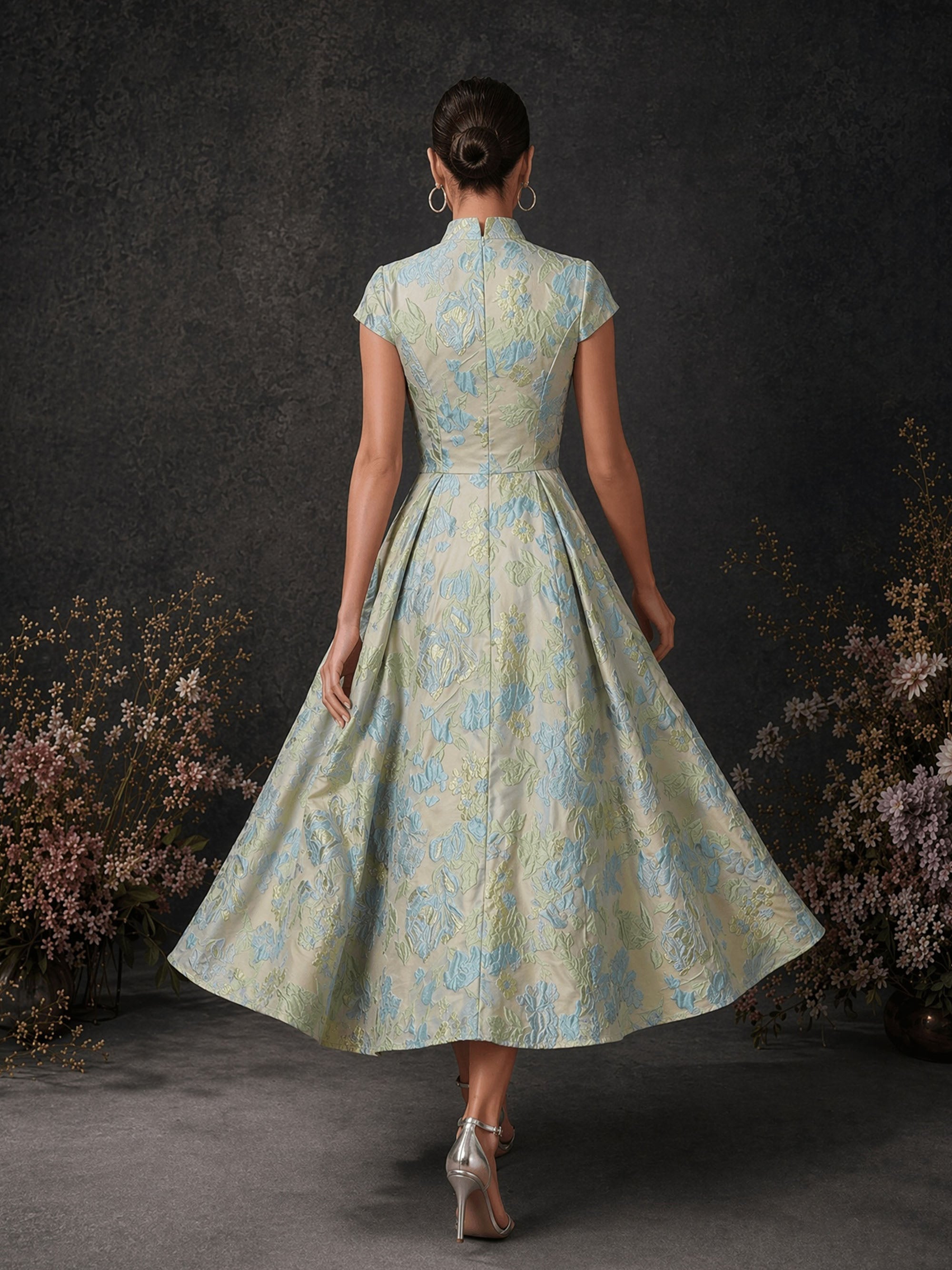 BOLODOO champagne ice blue floral jacquard mandarin collar cap sleeve A-line tea length dress – back full length view showing zipper closure and box pleated skirt