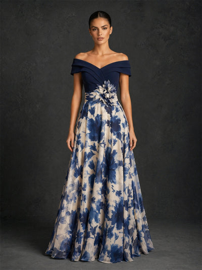 BOLODOO navy blue off-shoulder crossover bodice ivory navy watercolor floral chiffon A-line floor length gown with 3D flower corsage – front full length direct gaze view