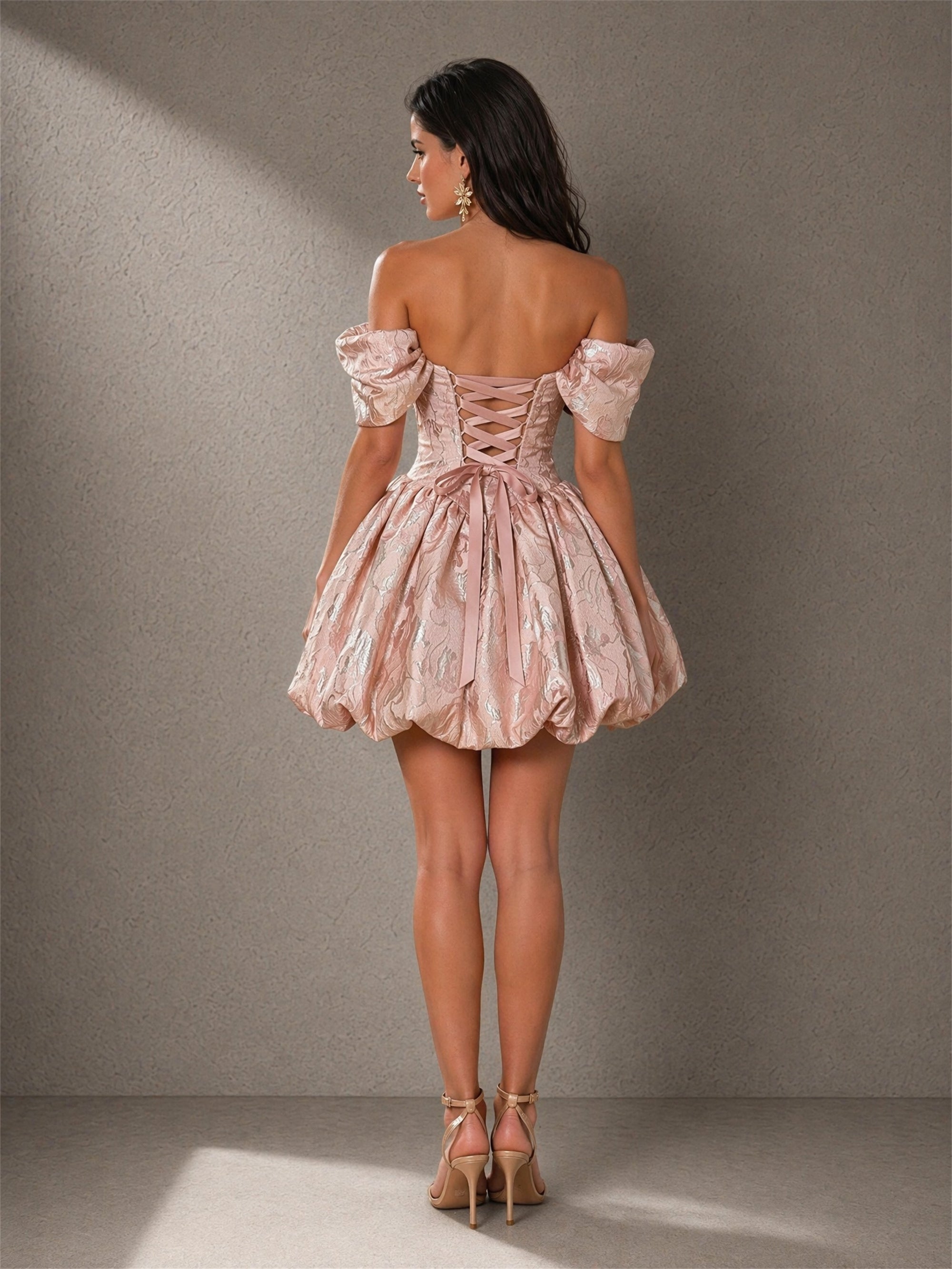BOLODOO blush rose gold metallic jacquard off-shoulder puff sleeve corset bubble mini dress close-up front view showing dual 3D oversized flower corsage pearl detail and sweetheart neckline