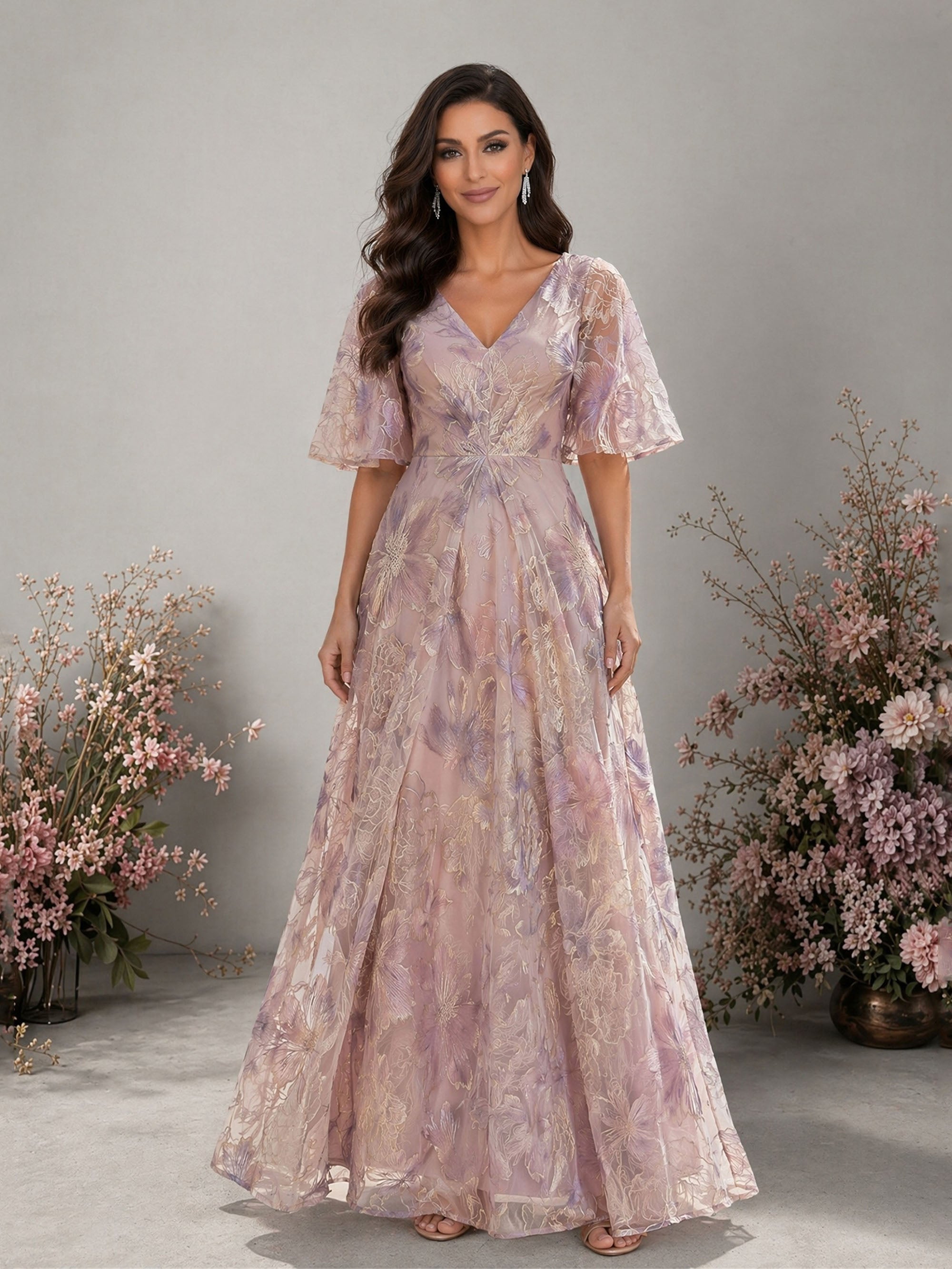 BOLODOO lavender metallic floral embroidered organza V-neck flutter sleeve empire waist A-line floor length gown – front full length smiling direct gaze view