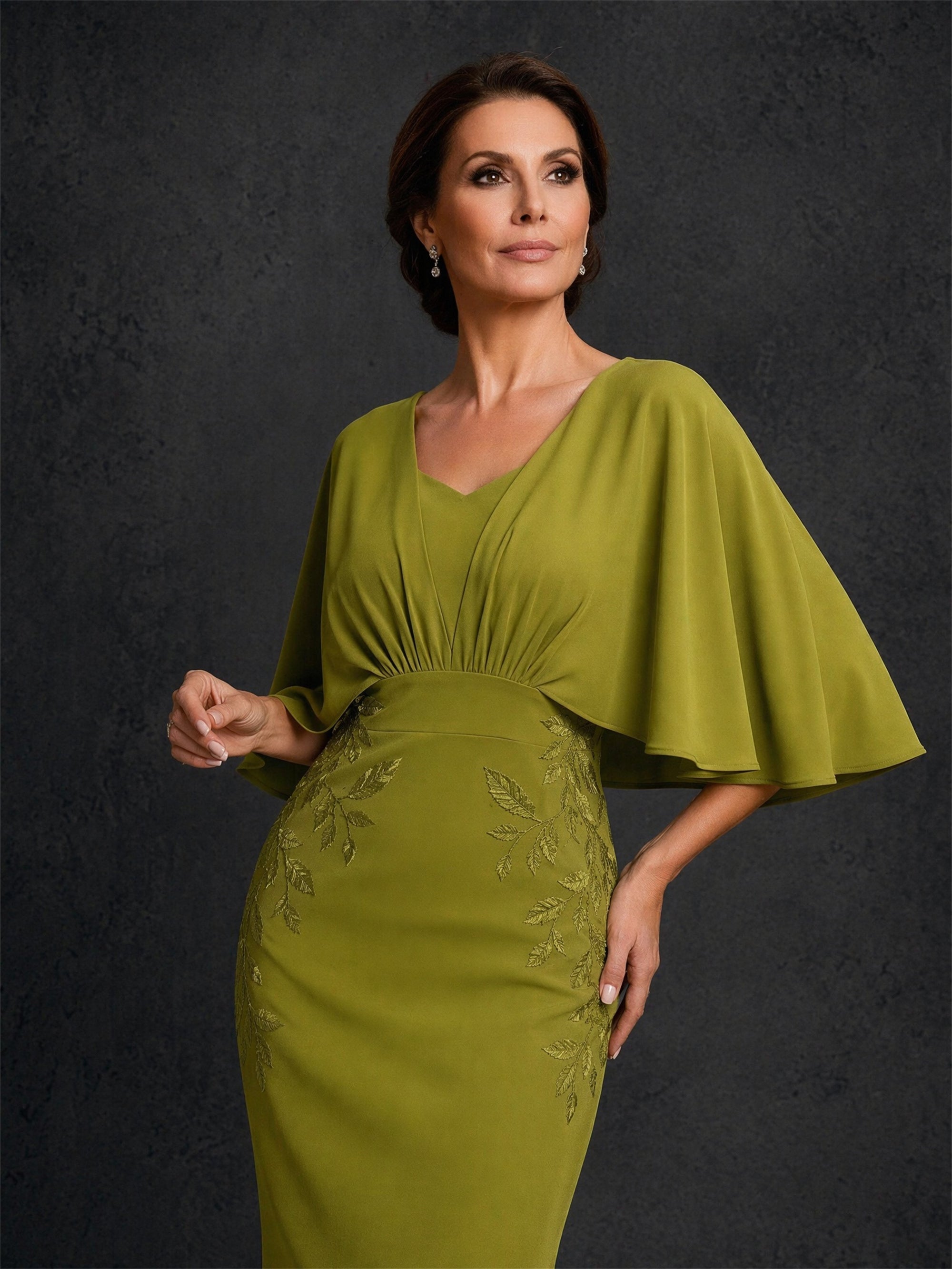 BOLODOO olive green gown – V-neck cape sleeve bodice and hip leaf embroidery close-up detail