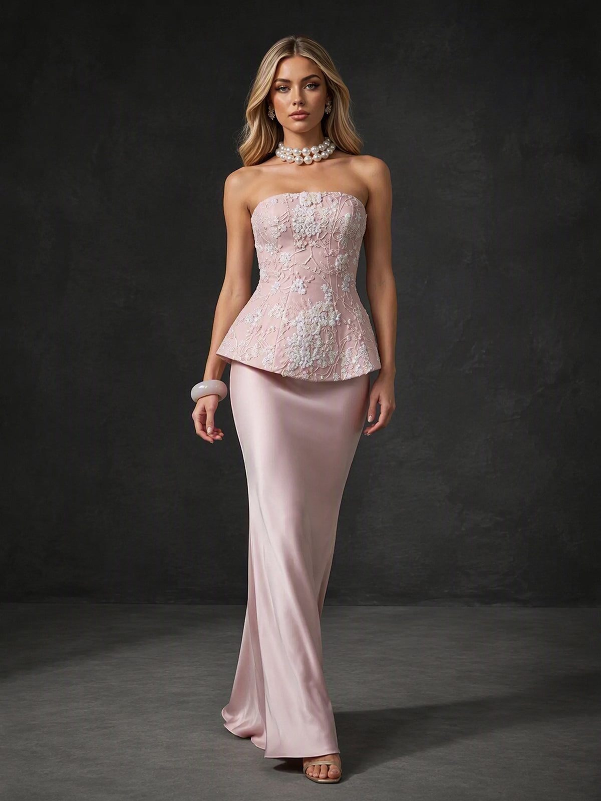 BOLODOO BX0012 blush pink lace peplum mermaid gown - three-quarter front view showing strapless neckline, structured peplum and body-skimming satin mermaid silhouette