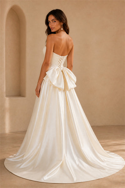 BOLODOO Ivory Satin Strapless A-Line Wedding Gown - Front View with Bow Hip Draping