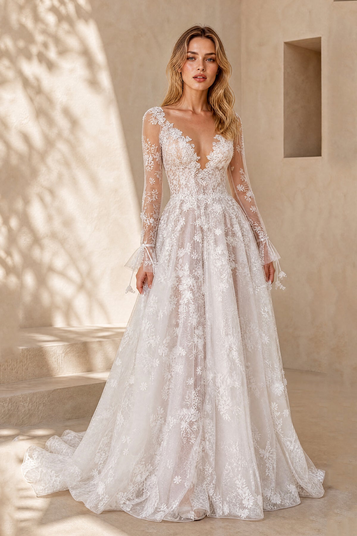 White deep V-neck floral lace bridal gown with sheer long sleeves and floor length skirt