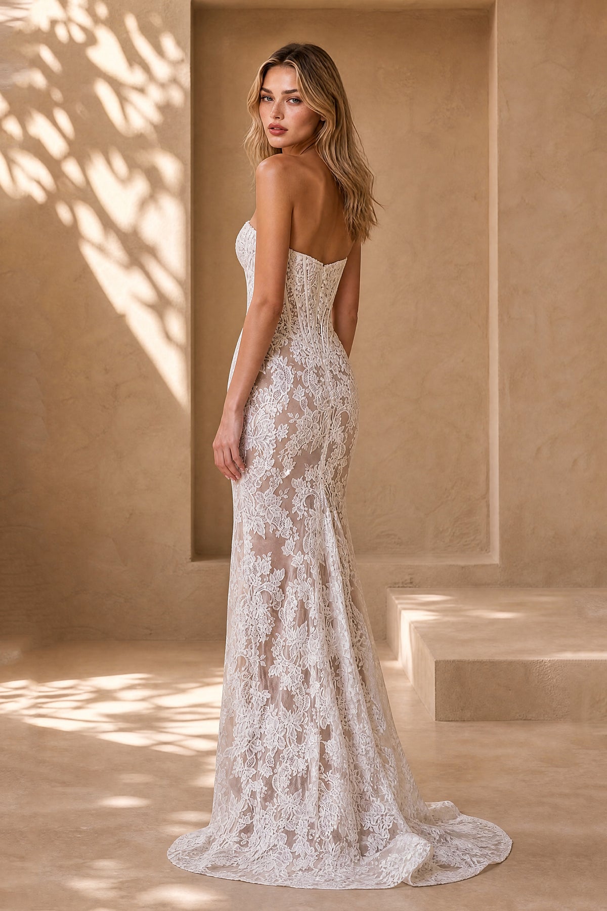 Ivory floral lace strapless mermaid bridal gown with open back and sweep train