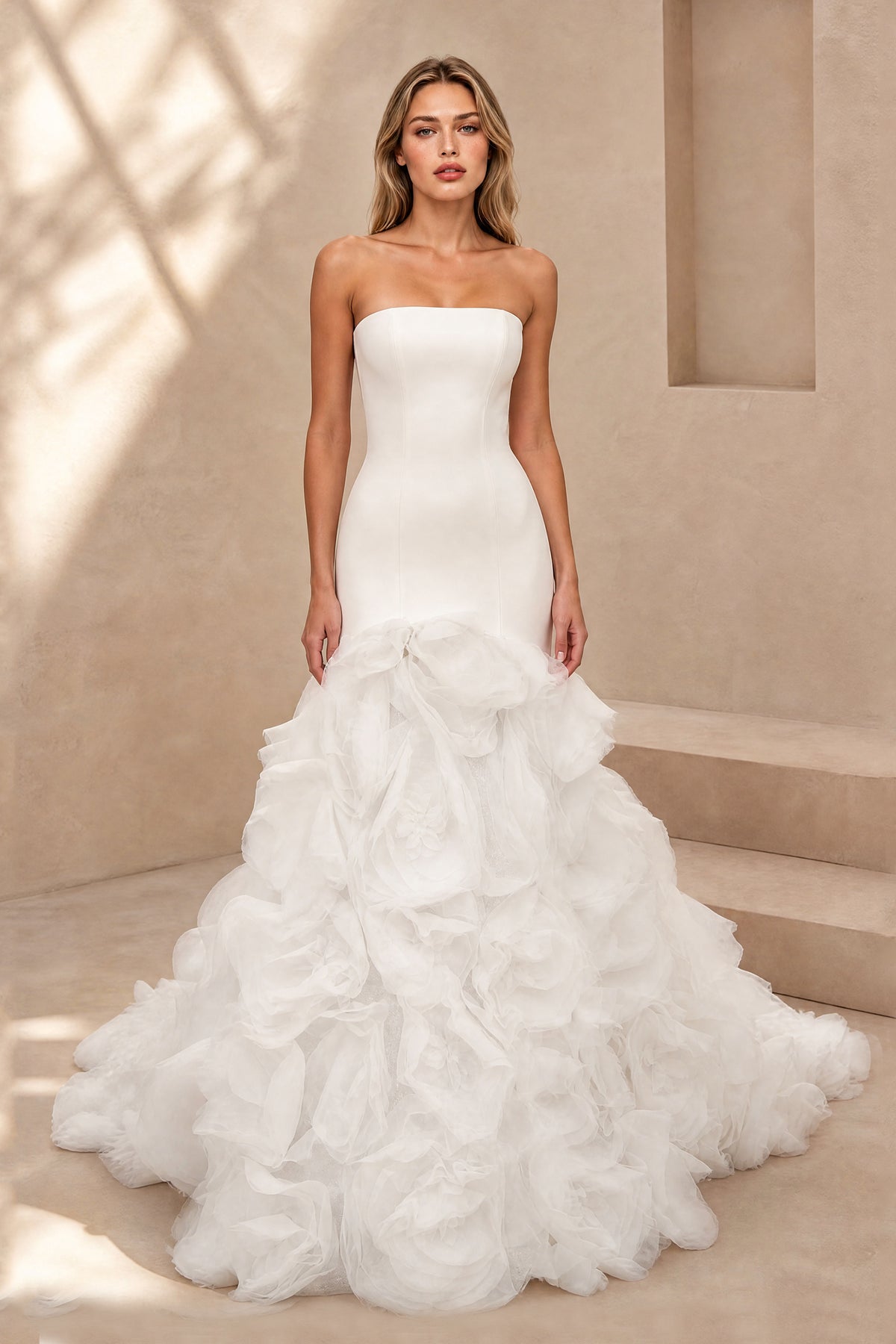 Ivory strapless mermaid bridal gown with low V back and dramatic organza ruffle train