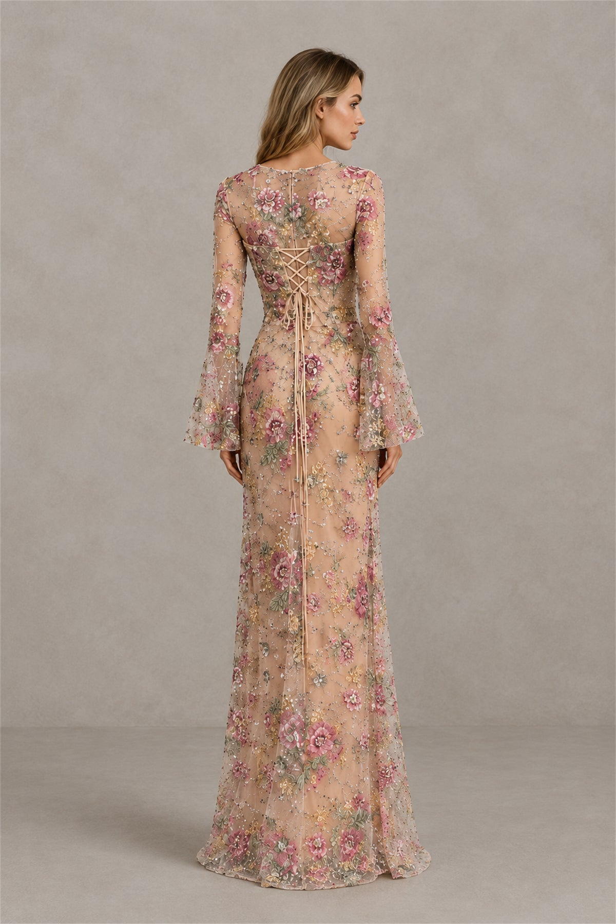 Back view of BOLODOO champagne floral gown showing illusion upper back and lace-up bodice