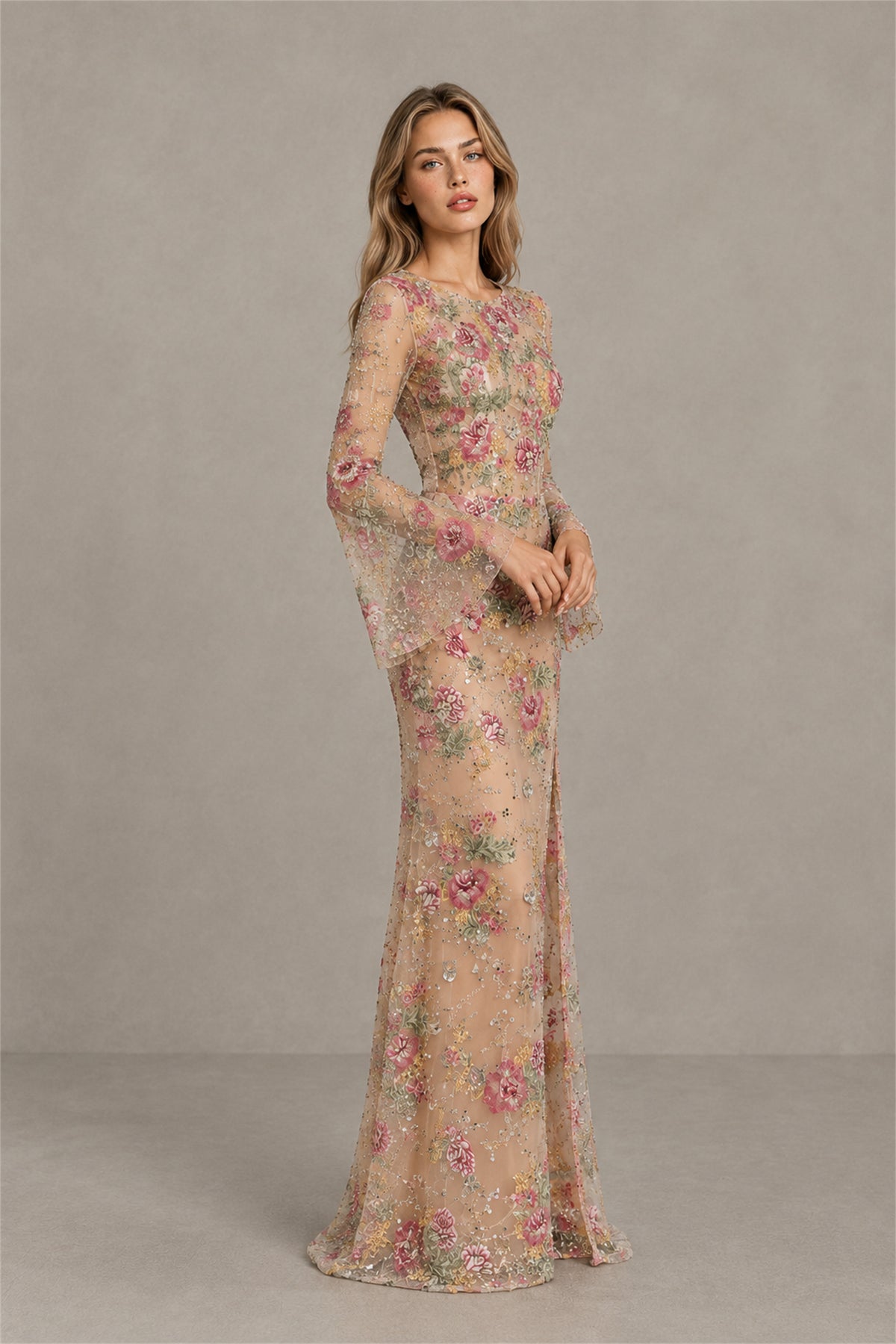 Side view of BOLODOO champagne embroidered tulle gown with sheer long bell sleeves