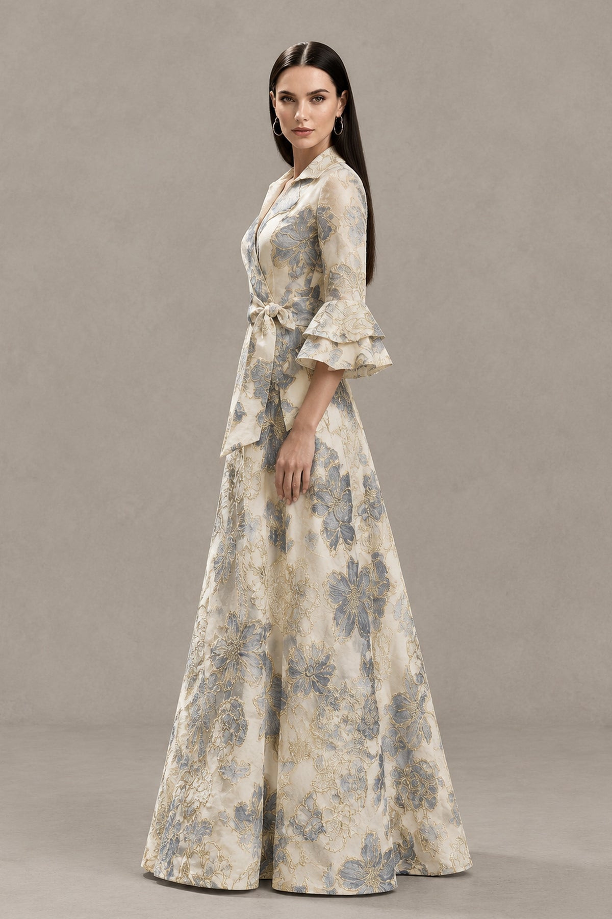 BOLODOO beige floral jacquard formal maxi dress, three-quarter view showing the wrap-style bodice, waist tie and ruffle sleeves