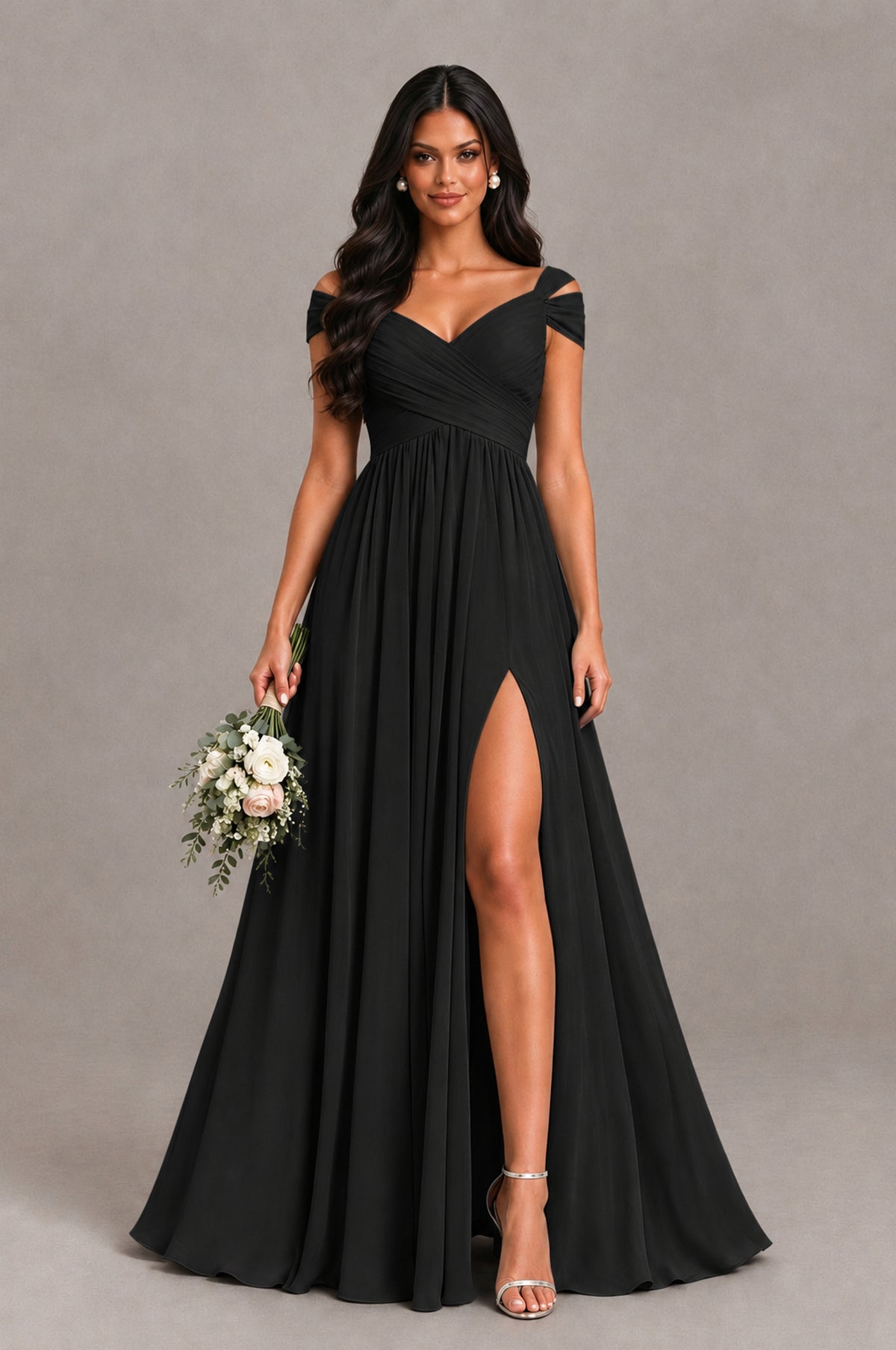 Black chiffon bridesmaid dress with cold shoulder sleeves and front slit, styled with bouquet