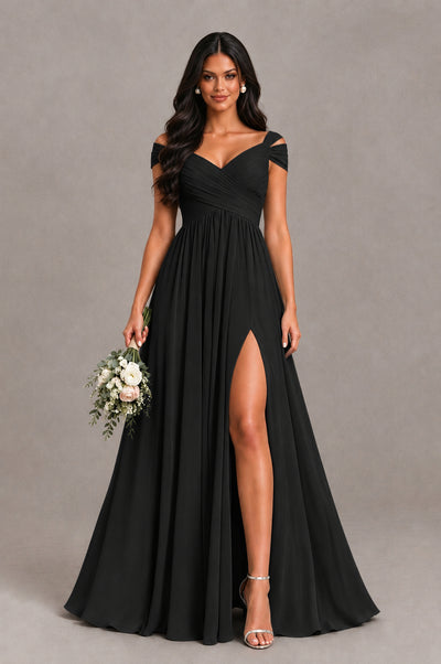 Black chiffon bridesmaid dress with cold shoulder sleeves and front slit, styled with bouquet