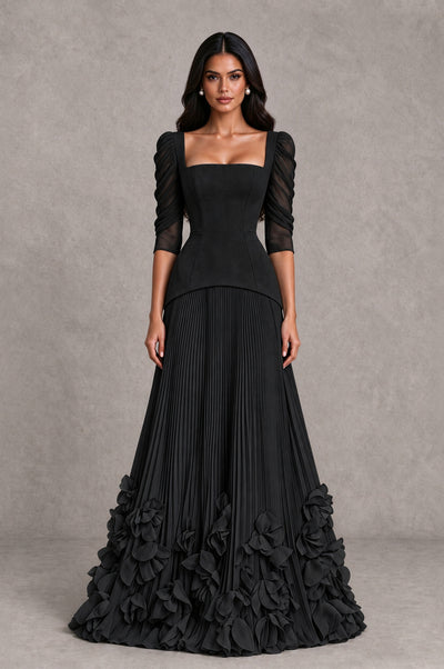 BOLODOO black square-neck evening dress with puff sleeves, pleated skirt and floral applique hem, front view