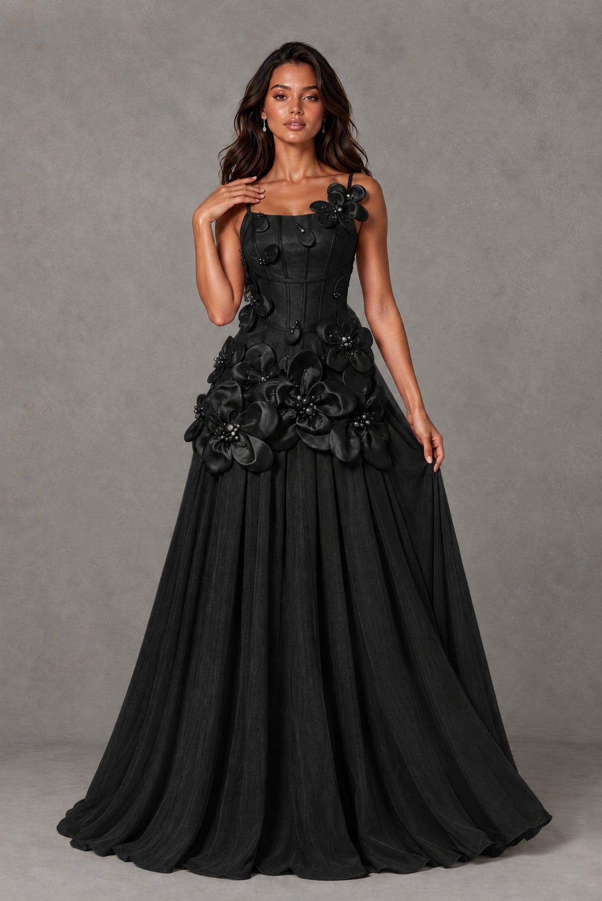 Three-quarter view of BOLODOO black sleeveless floral appliqué formal gown