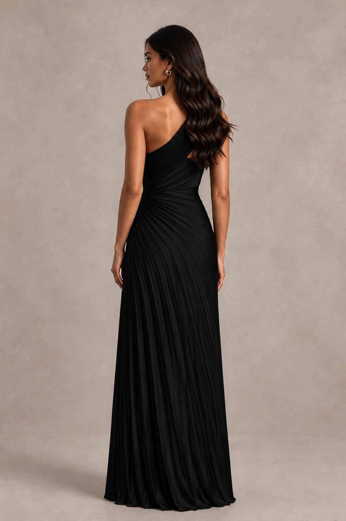 Black one shoulder pleated formal gown with covered back, back view