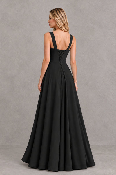 Side view of BOLODOO black sleeveless floor-length dress showing ruffled high slit