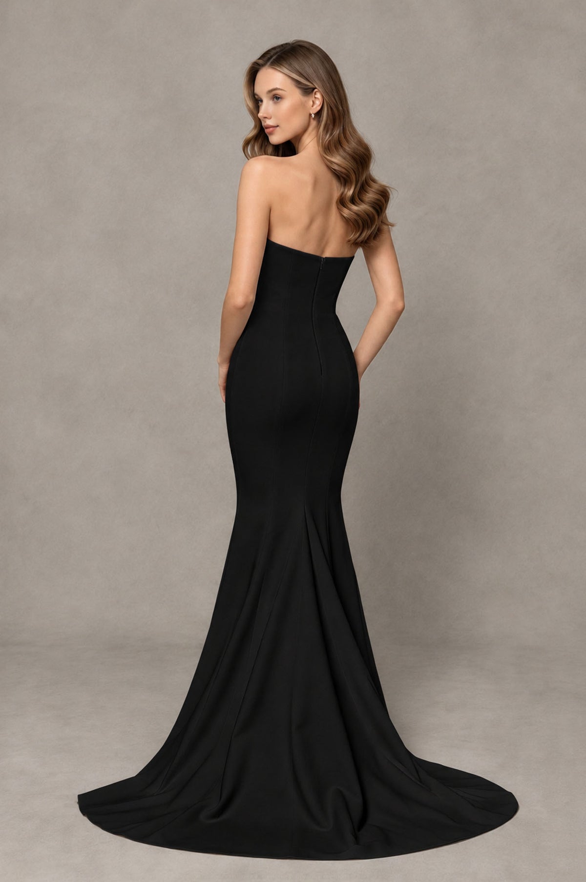 Black strapless mermaid formal gown with covered back and long train, back view