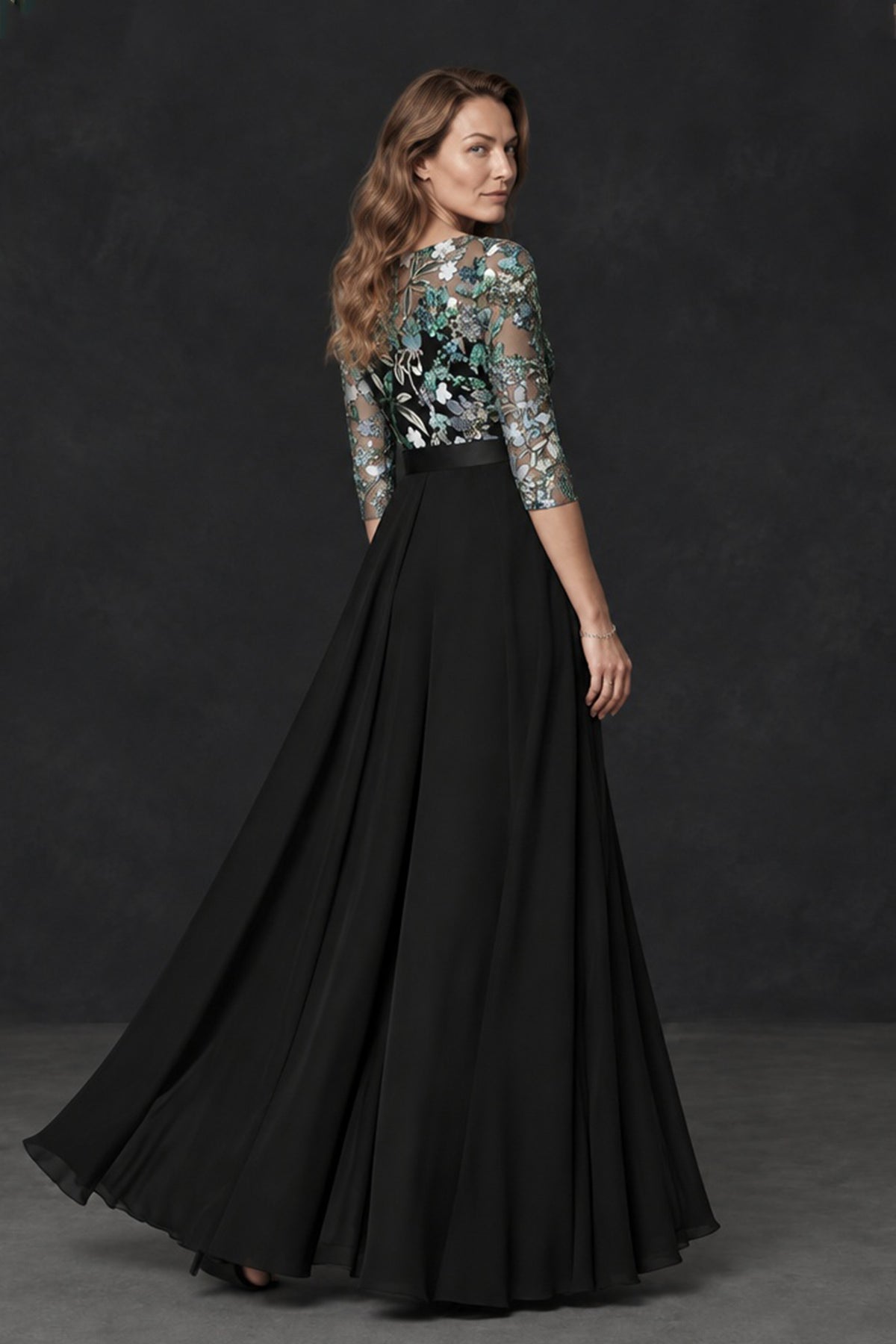 BOLODOO black floral embroidered formal dress side view showing sheer three-quarter sleeve and long skirt