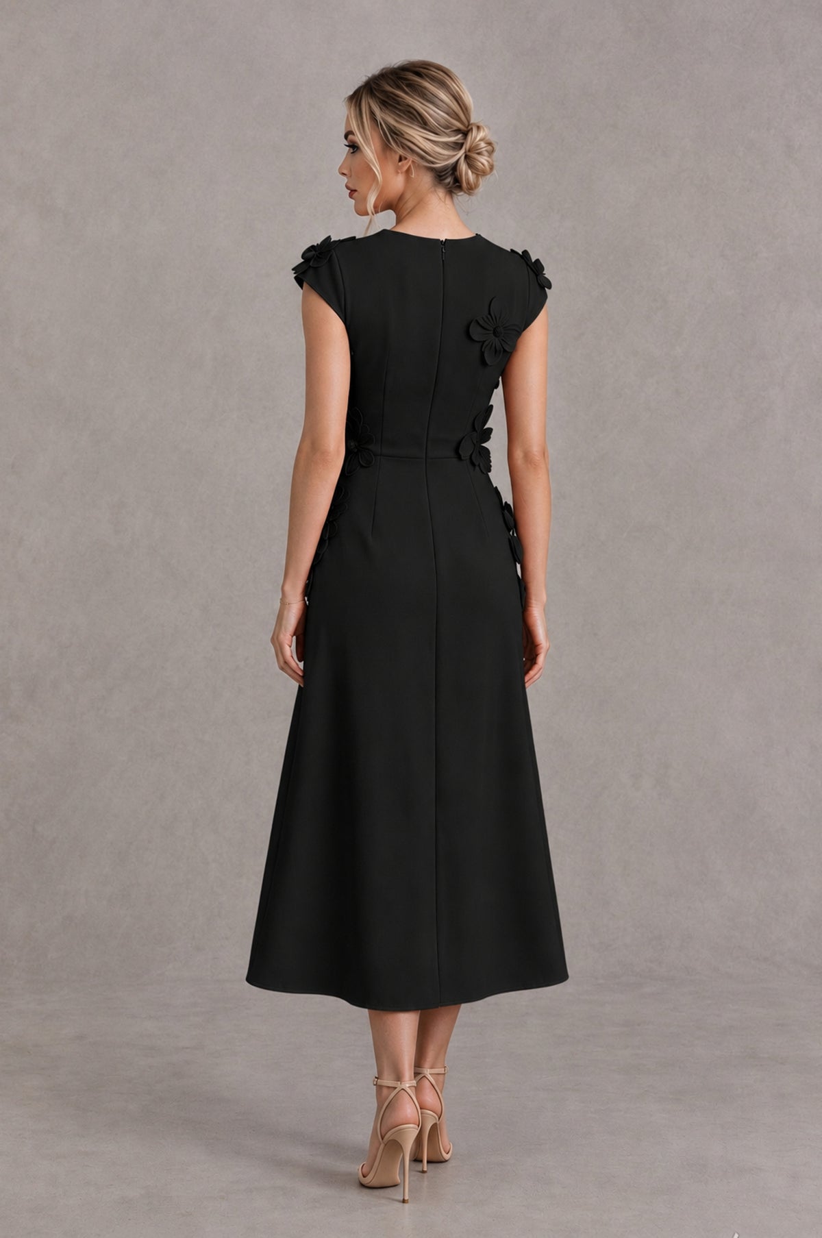 Black floral midi cocktail dress back view showing covered back and A-line skirt