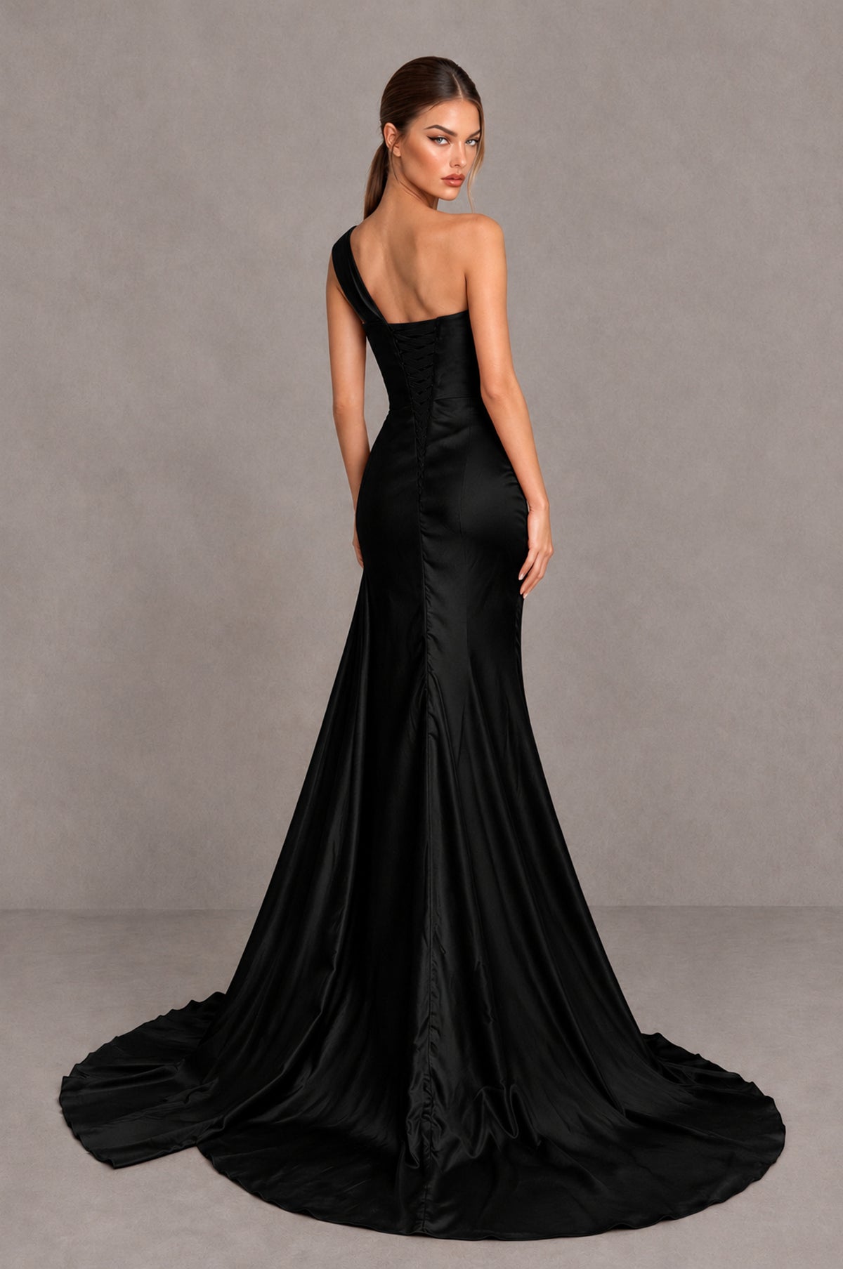 Black one shoulder satin mermaid formal gown with covered back and train, back view