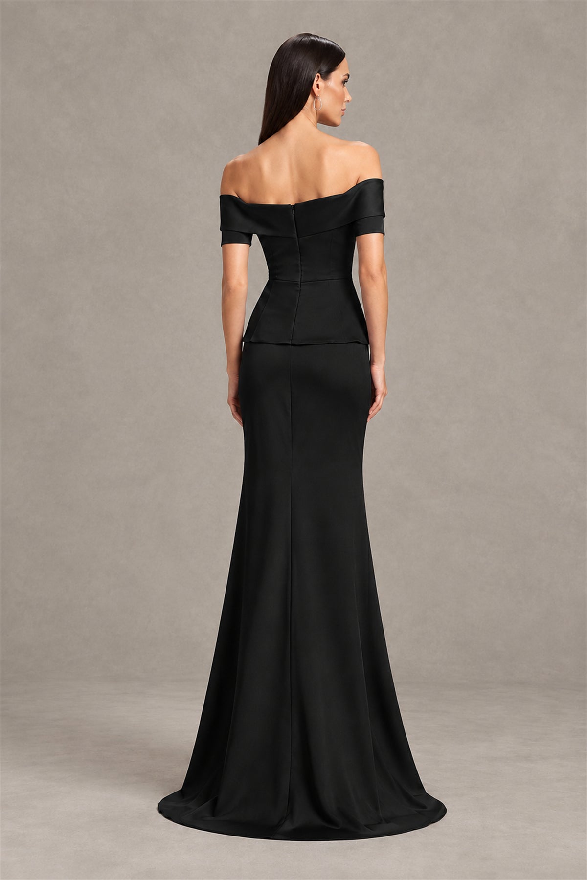 Three quarter view of black off shoulder mermaid evening dress with embellished waist