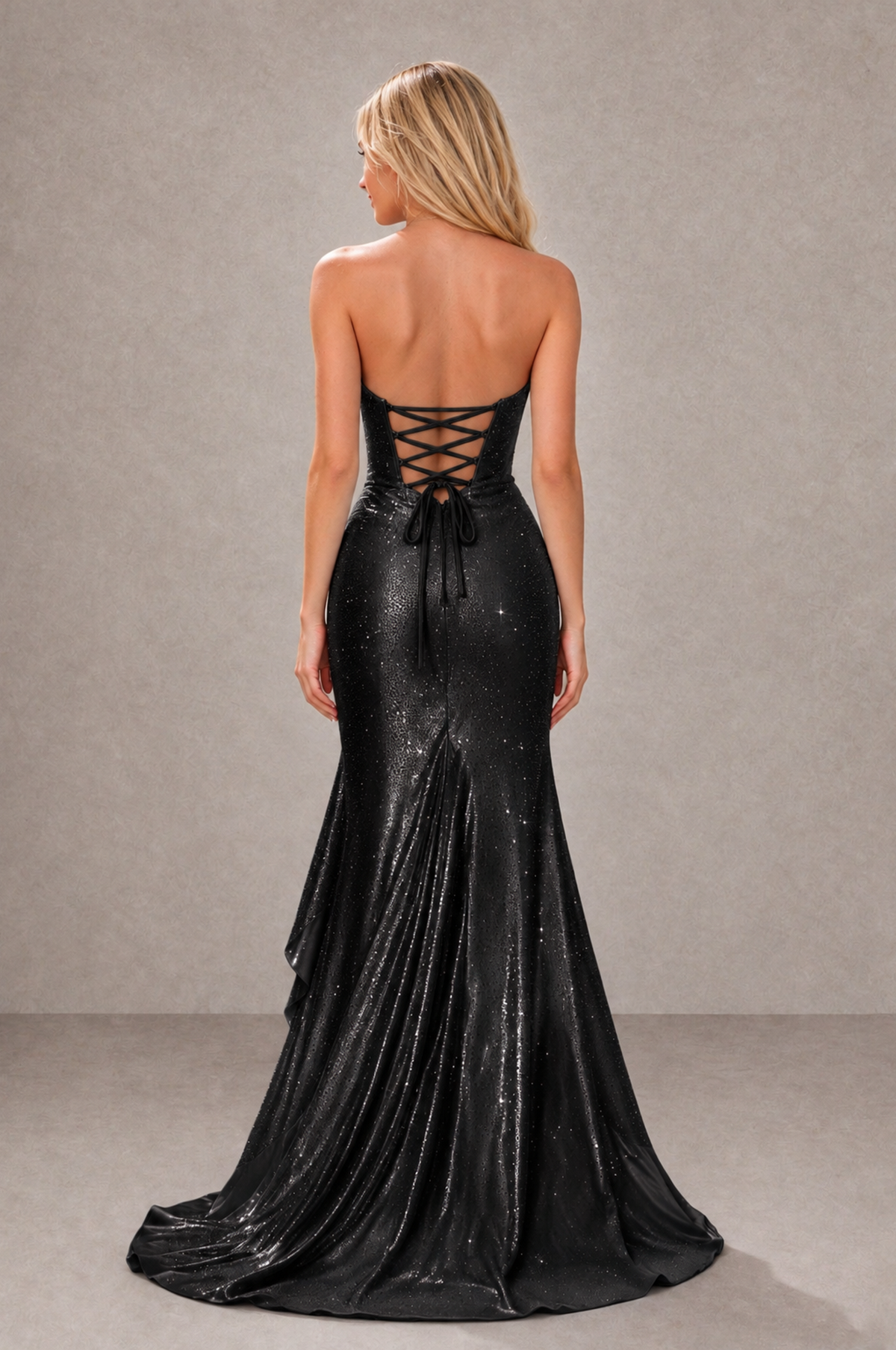Back of BOLODOO black mermaid gown showing open lace-up corset back and sweep train