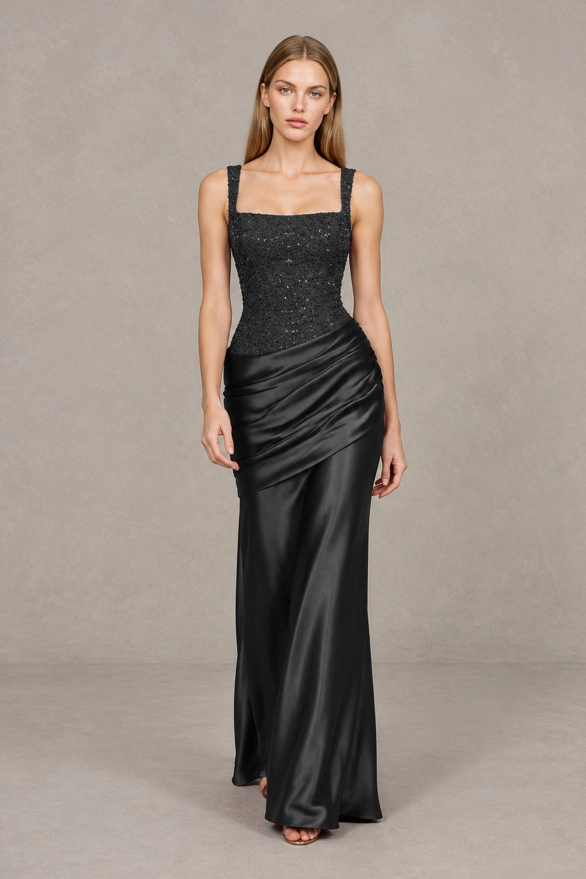 BOLODOO black sleeveless floor-length formal gown showing fitted silhouette and draped hip ruching