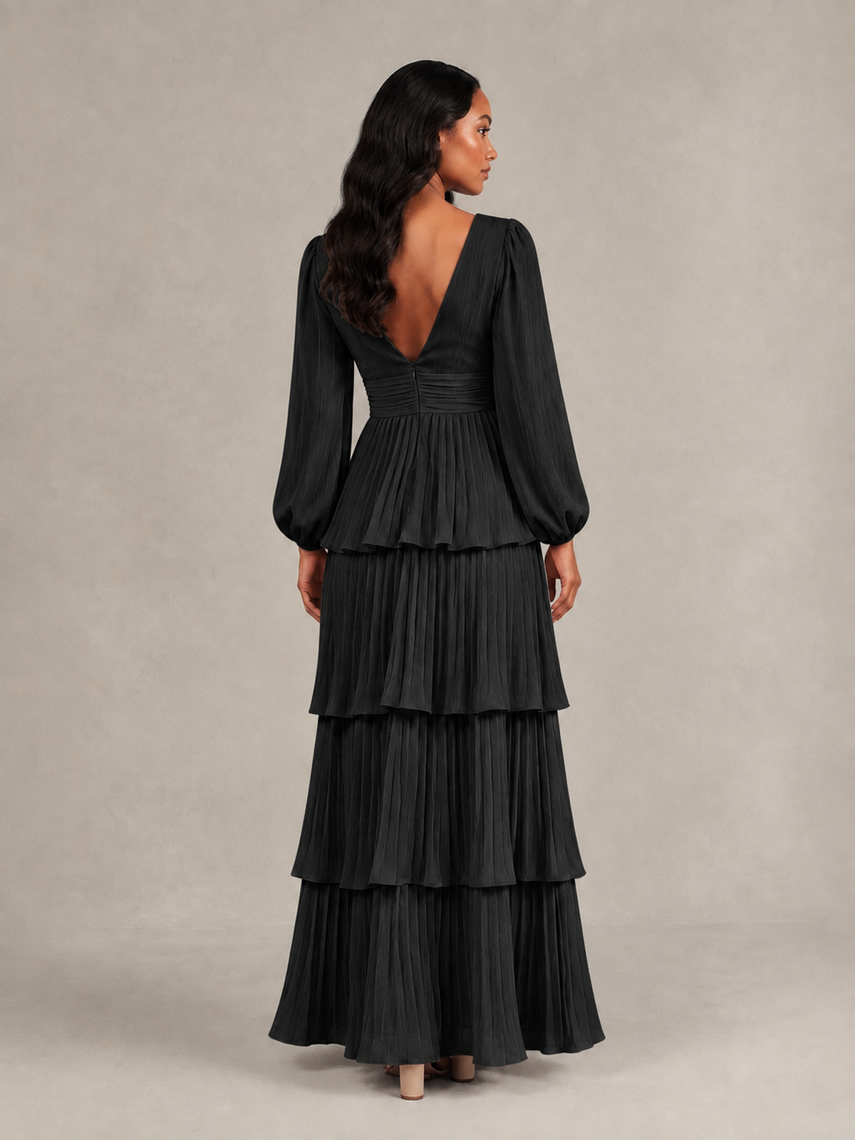 Back view of black tiered maxi dress showing low V-back and long blouson sleeves