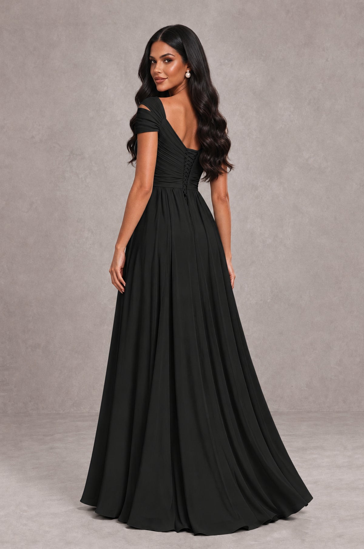 Black cold shoulder evening gown with V back and flowing chiffon skirt, back view