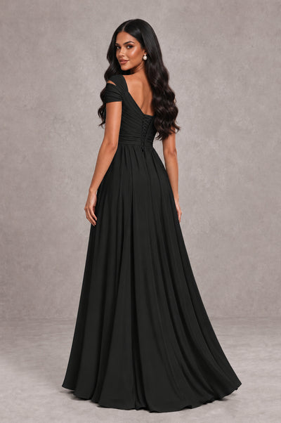 Black cold shoulder evening gown with V back and flowing chiffon skirt, back view